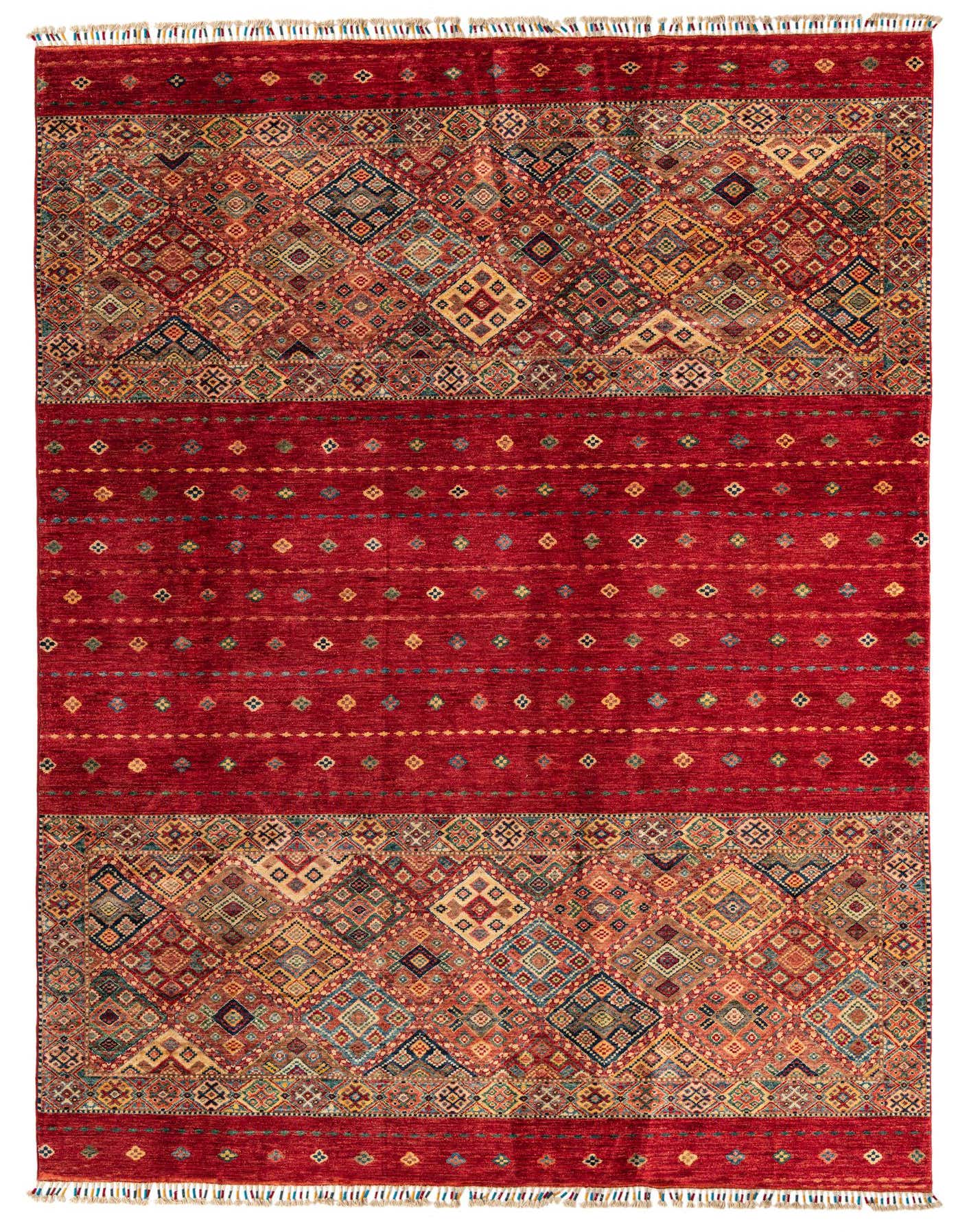 A 7x10 rectangular red Oriental rug with intricate geometric patterns and colorful diamond motifs, featuring fringe.