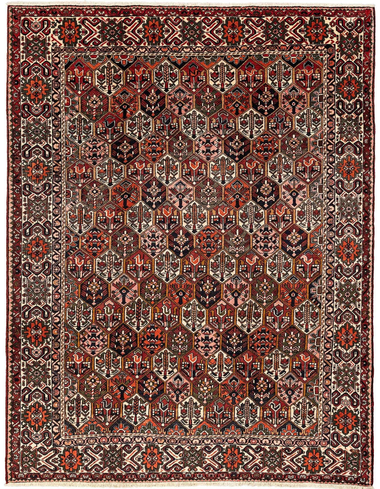 A 6x9 rectangular Bachtiar rug featuring a dense, traditional pattern of geometric and floral motifs in various shades of red, cream, and dark accents.