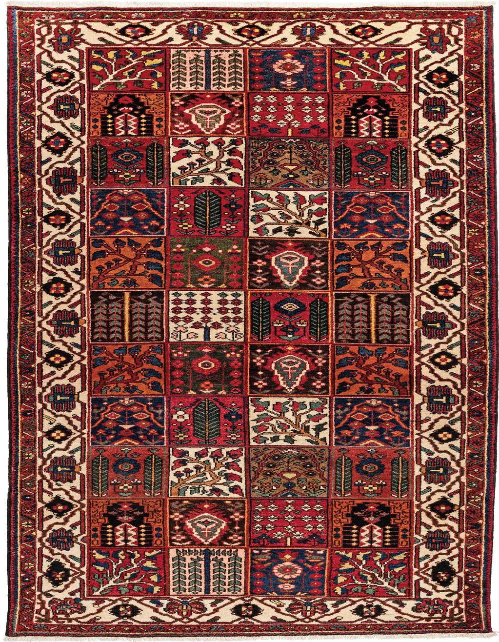 A 6x9 rectangular Bachtiar rug featuring a patchwork of traditional Persian patterns in various shades of red, blue, green, and orange, framed by an ivory border with intricate motifs.