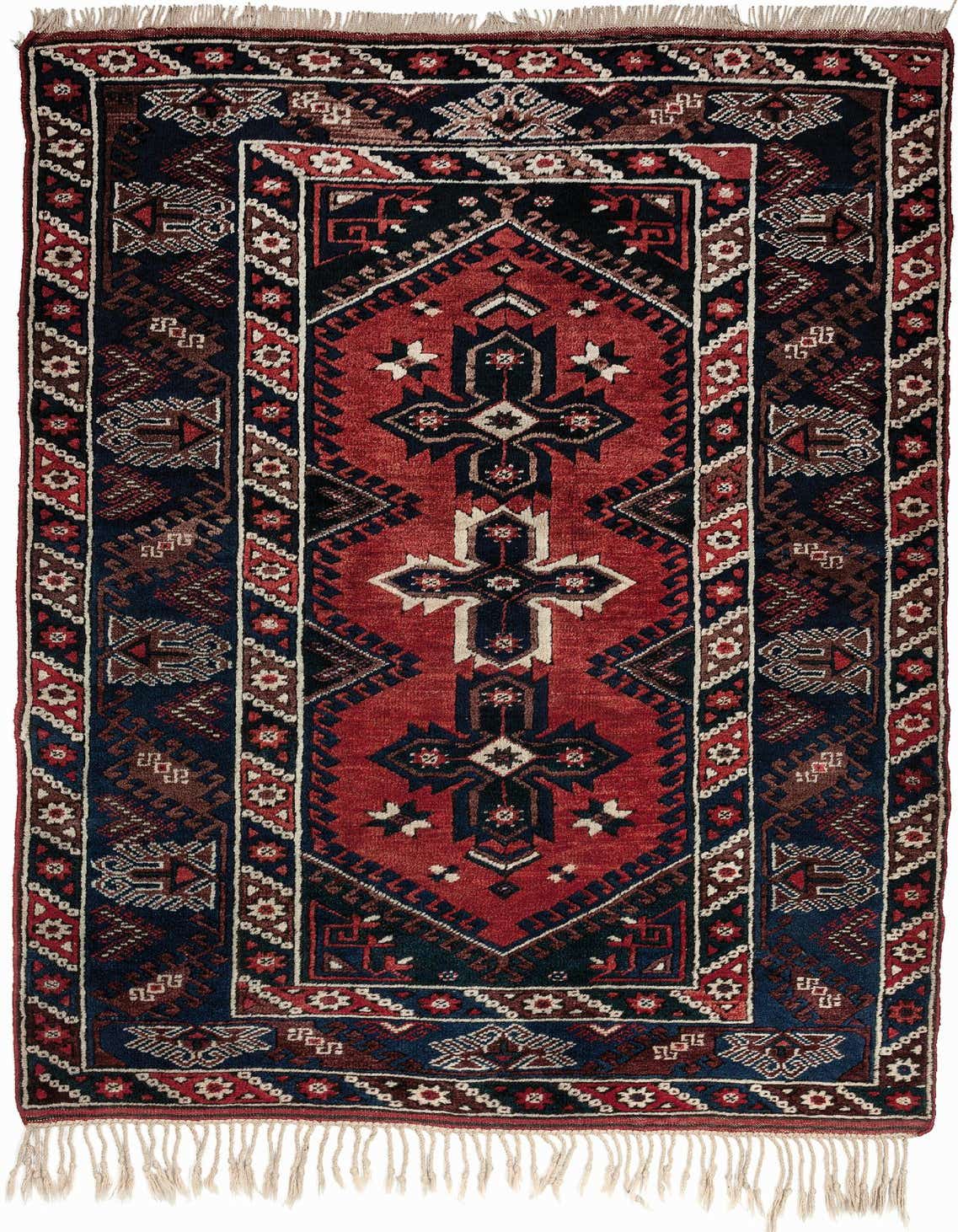 A 4x6 rectangular Balouch tribal rug featuring a central red medallion with intricate navy, brown, and white patterns, bordered by matching geometric designs and fringe.