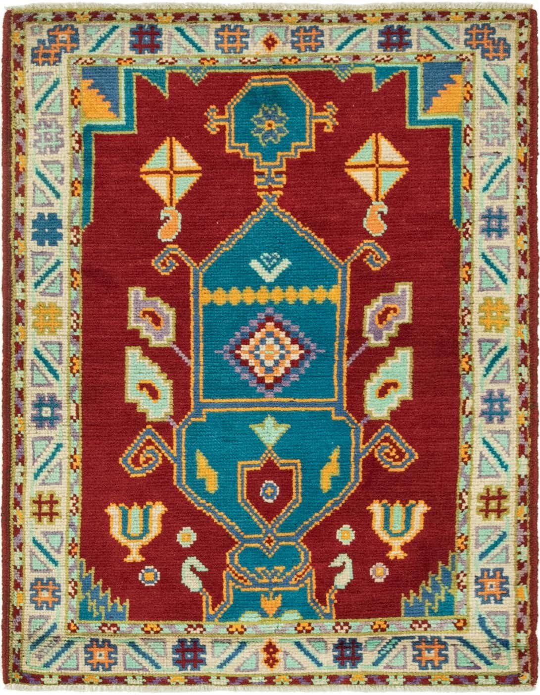 A 3x4 rectangular Balouch rug with a deep red field and a central teal medallion, surrounded by traditional Southwestern and tribal patterns in gold, light blue, and purple.