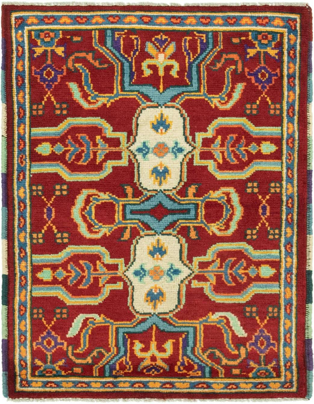 A 3x4 rectangular Balouch rug with a deep red field and intricate traditional Southwestern patterns in blue, gold, cream, and purple.