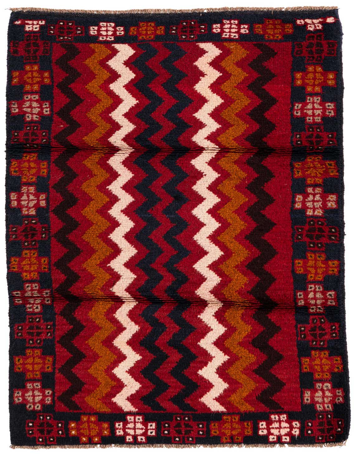 A 3x5 rectangular Balouch rug featuring bold red, navy, and cream zigzag patterns with tribal motifs.