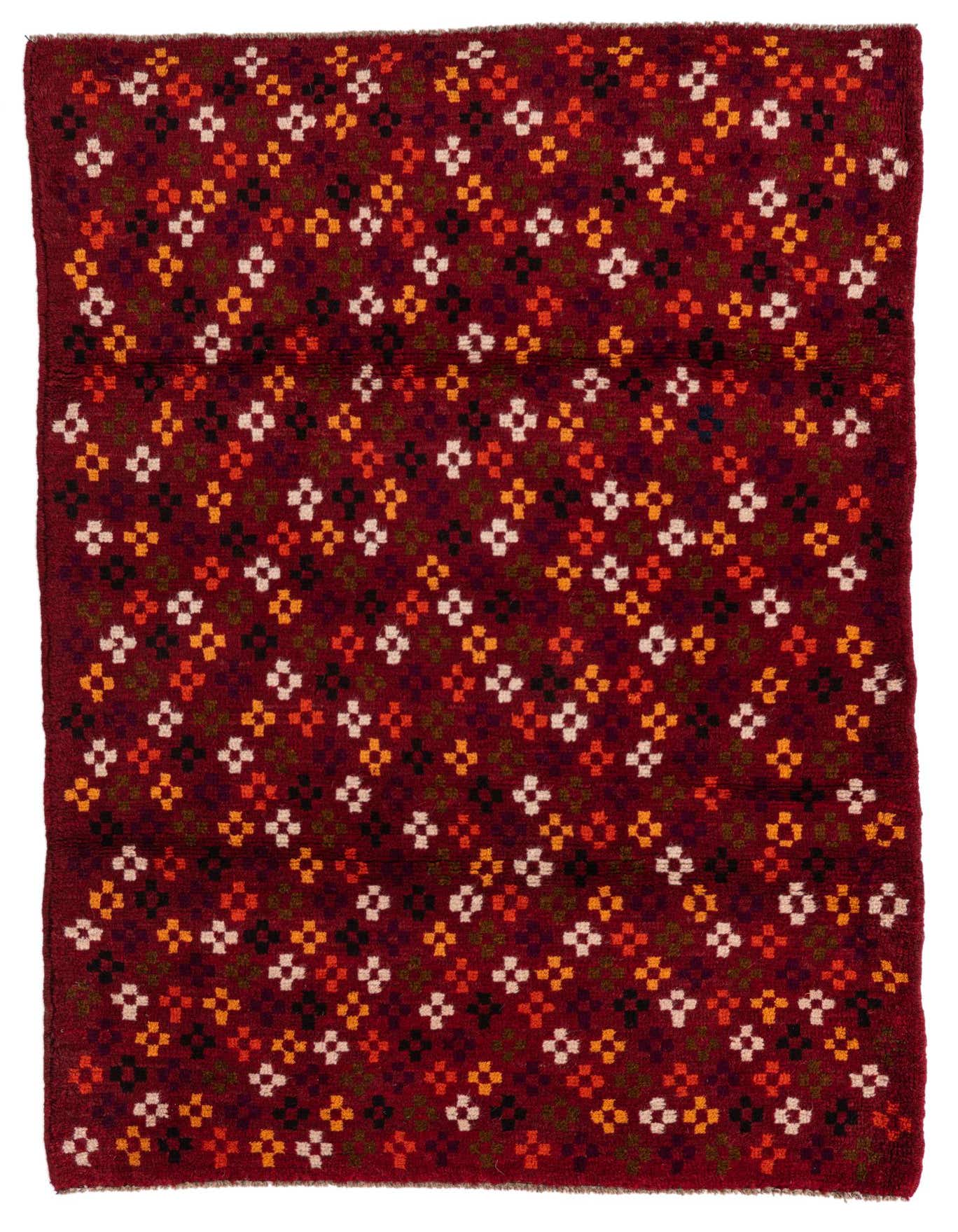 A 3x4 rectangular Balouch rug with a deep red background and a scattered tribal pattern of small white, orange, black, and green geometric motifs.