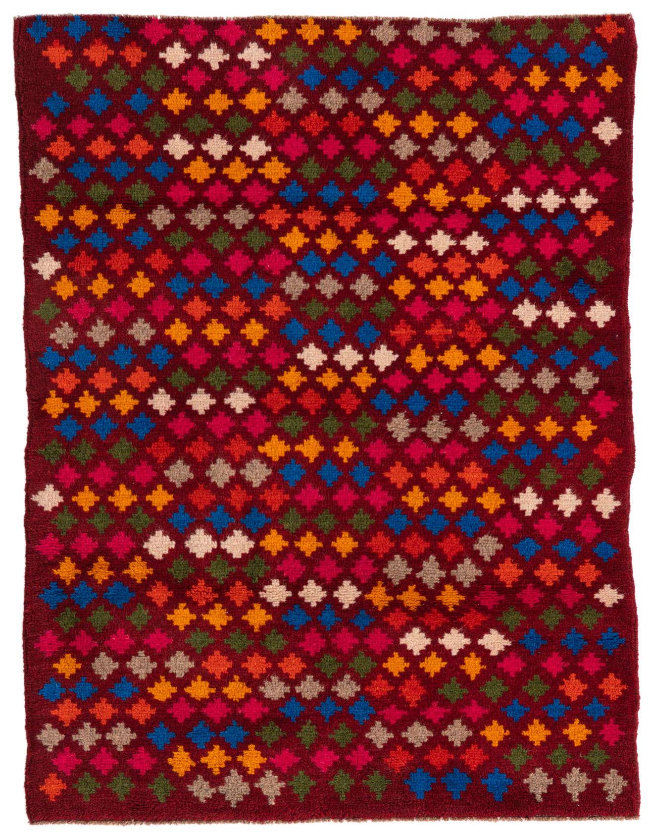 A 3x5 rectangular Balouch rug with a deep red background and a vibrant, repeating diamond pattern in various colors.