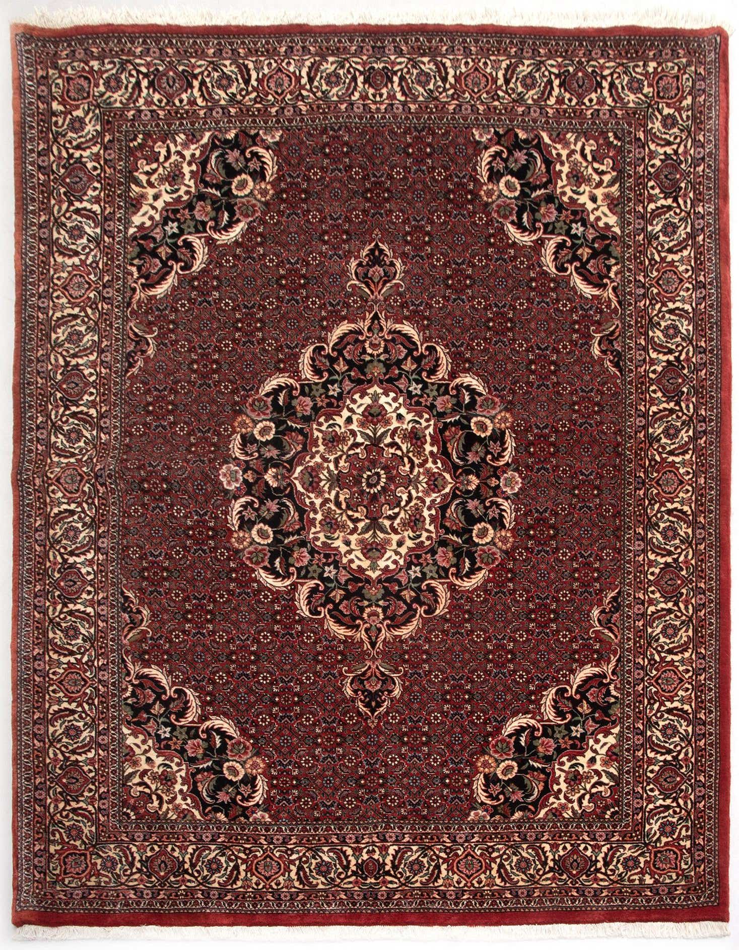 A 5x8 rectangular Bidjar Persian rug with a rich red field, intricate floral medallion, and ornate border.