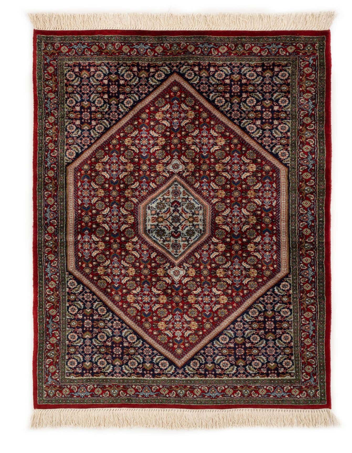 A 3x5 rectangular red Persian wool rug with a detailed floral medallion pattern and fringed ends.
