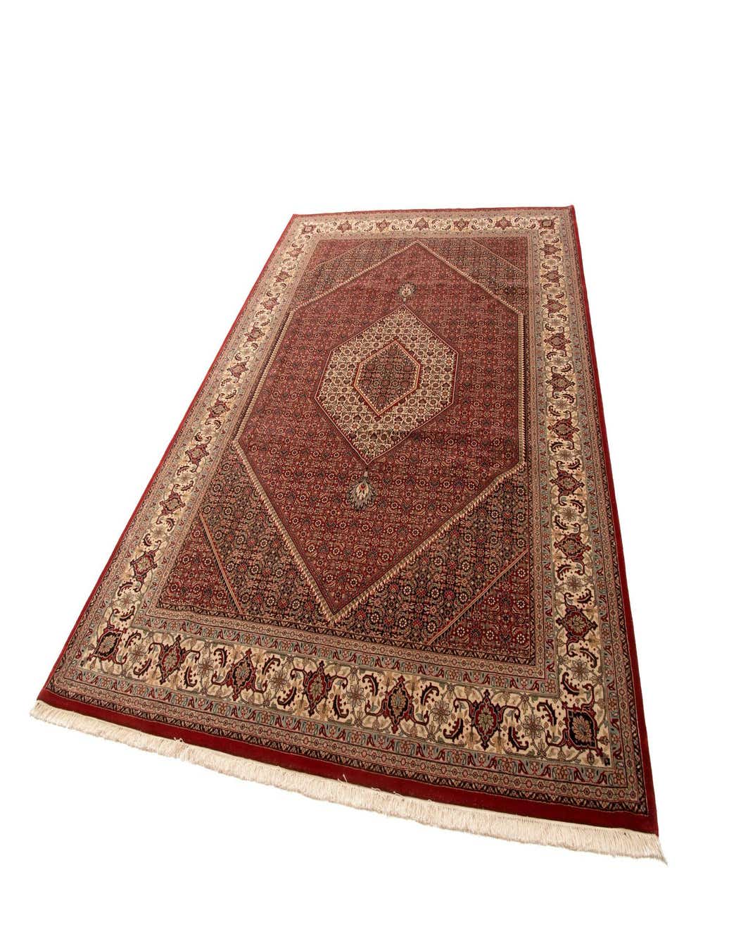 An 8x11 rectangular Bidjar wool rug with a traditional red and beige medallion pattern, featuring intricate floral motifs and a detailed border.