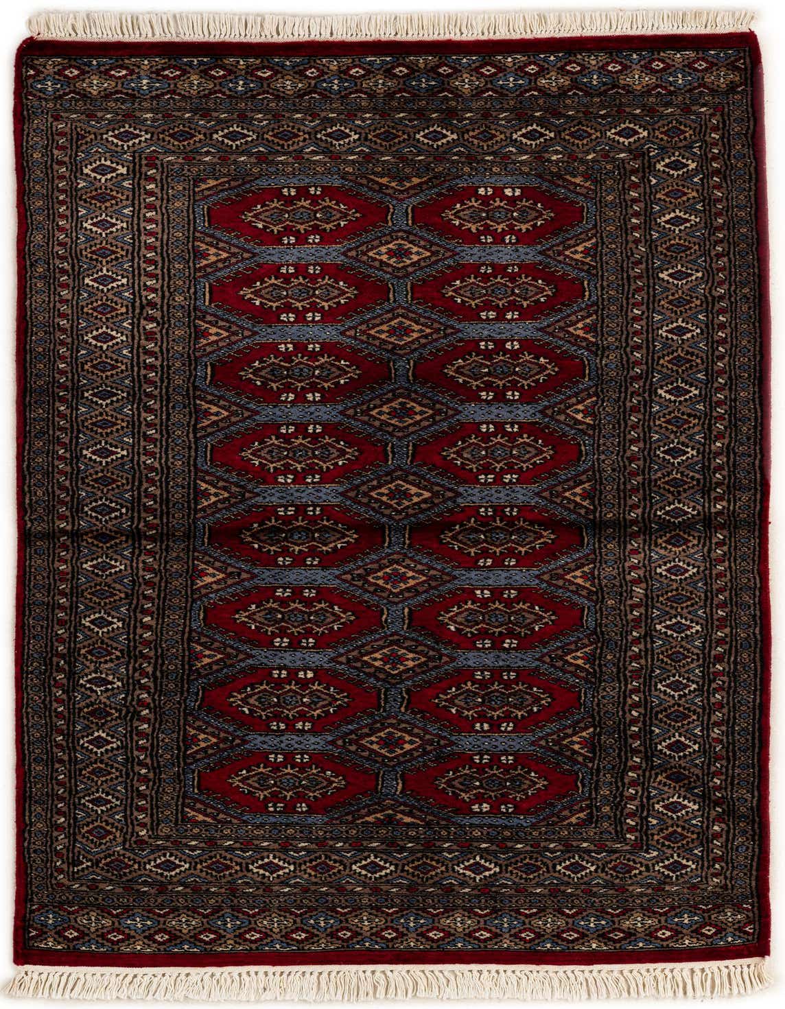 A 3x5 rectangular red tribal wool rug with intricate geometric patterns in blue, beige, and brown, featuring white fringe.