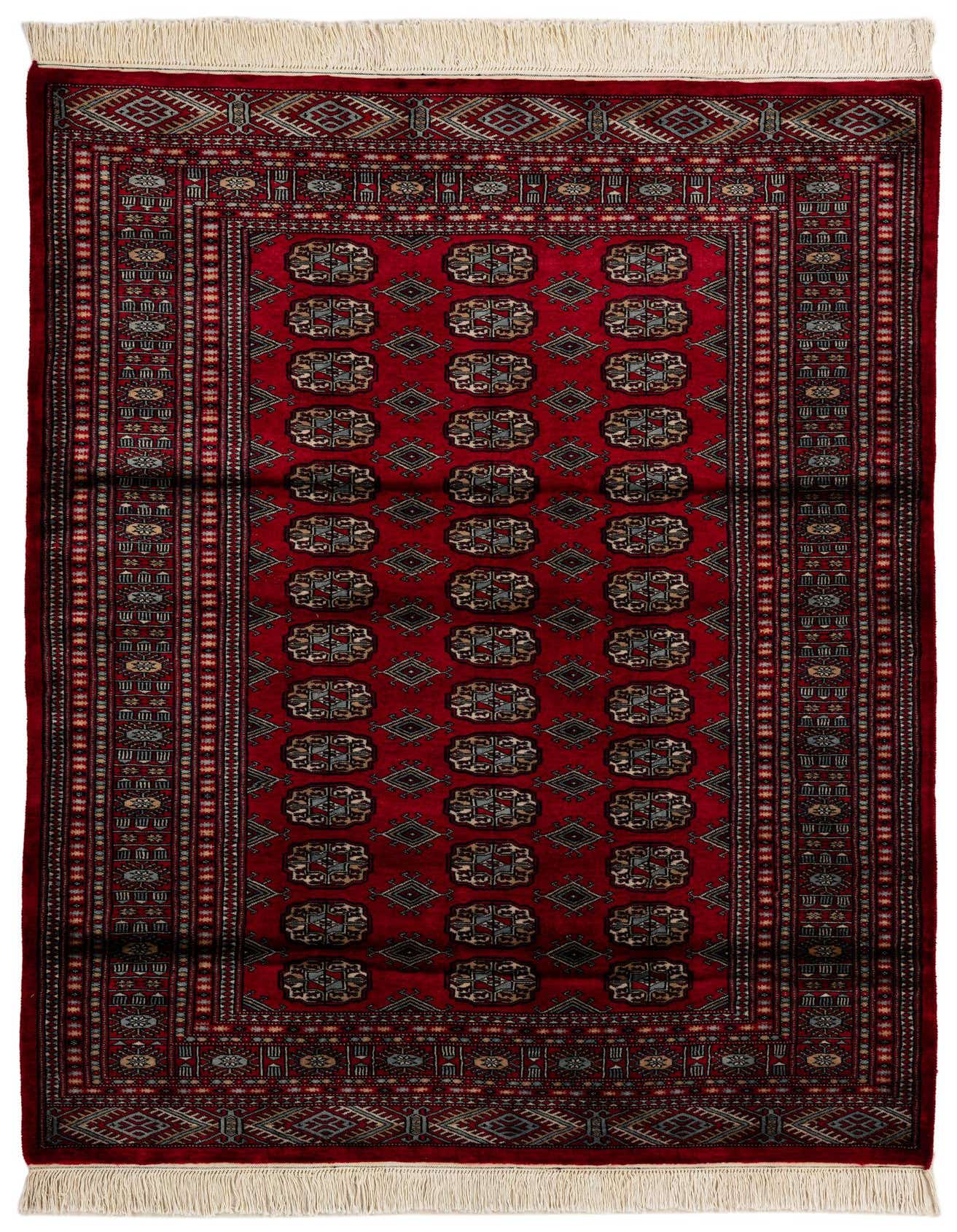 A 4x6 rectangular Bokhara rug in deep red with intricate tribal patterns and cream fringe.