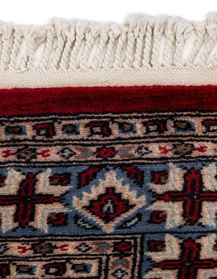 Detail image of  4' 3 x 6' 2  Hand Knotted Bokhara Oriental Wool Rug