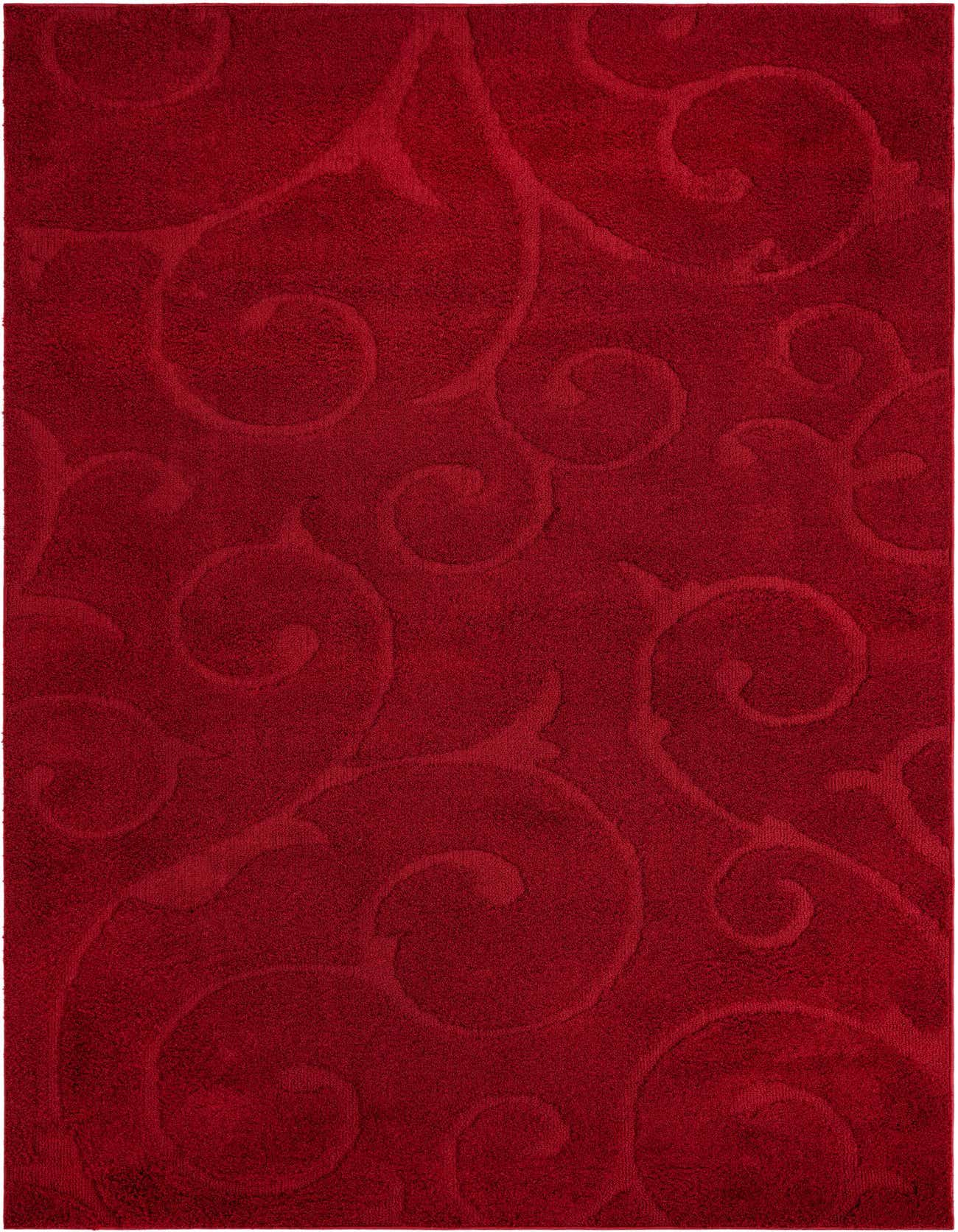 A 6x9 rectangular red shag rug with a subtle, raised floral and scroll pattern, perfect for an indoor living room or bedroom.