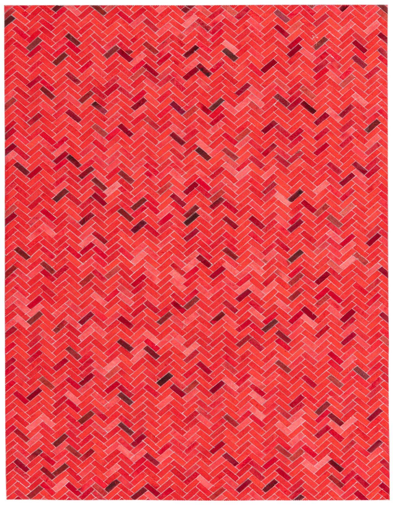 A 5x8 rectangular Cowhide rug in varying shades of red, featuring a modern herringbone pattern, suitable for a living room.