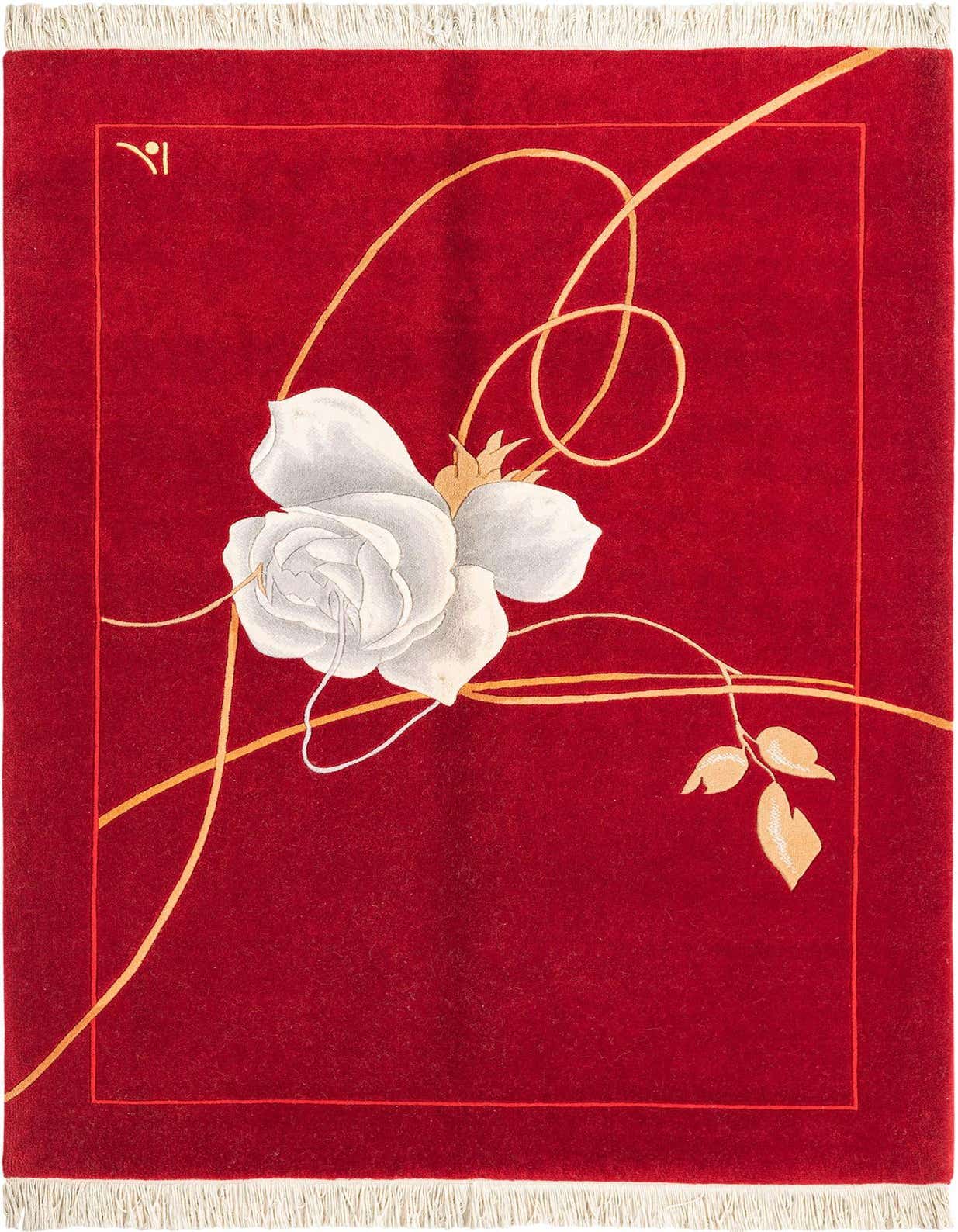 A 4x6 rectangular red rug with a large white rose and gold swirling vines, framed by a thin border, on a dark surface.