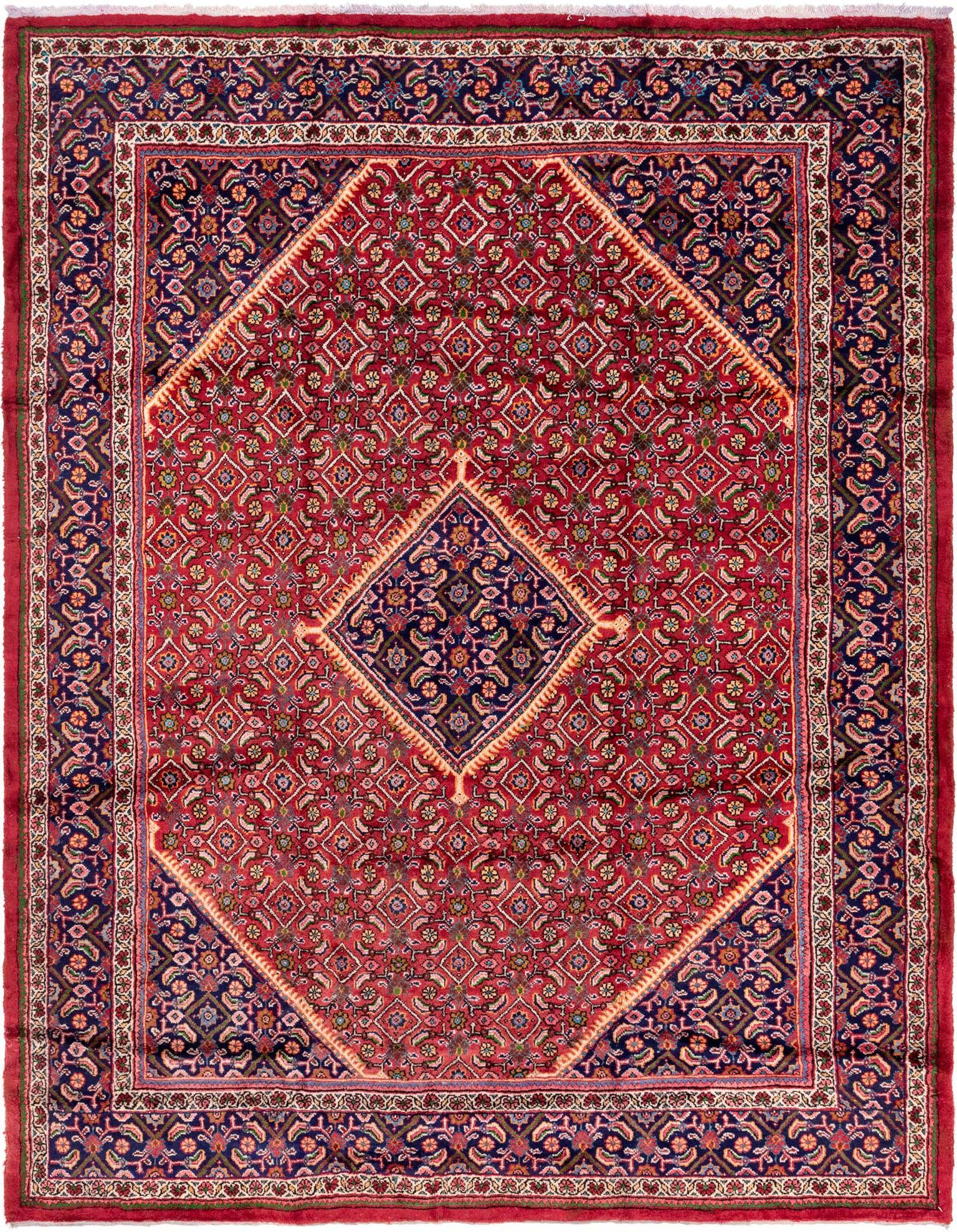 A 10x13 rectangular red Persian rug with an intricate navy blue medallion and floral patterns.