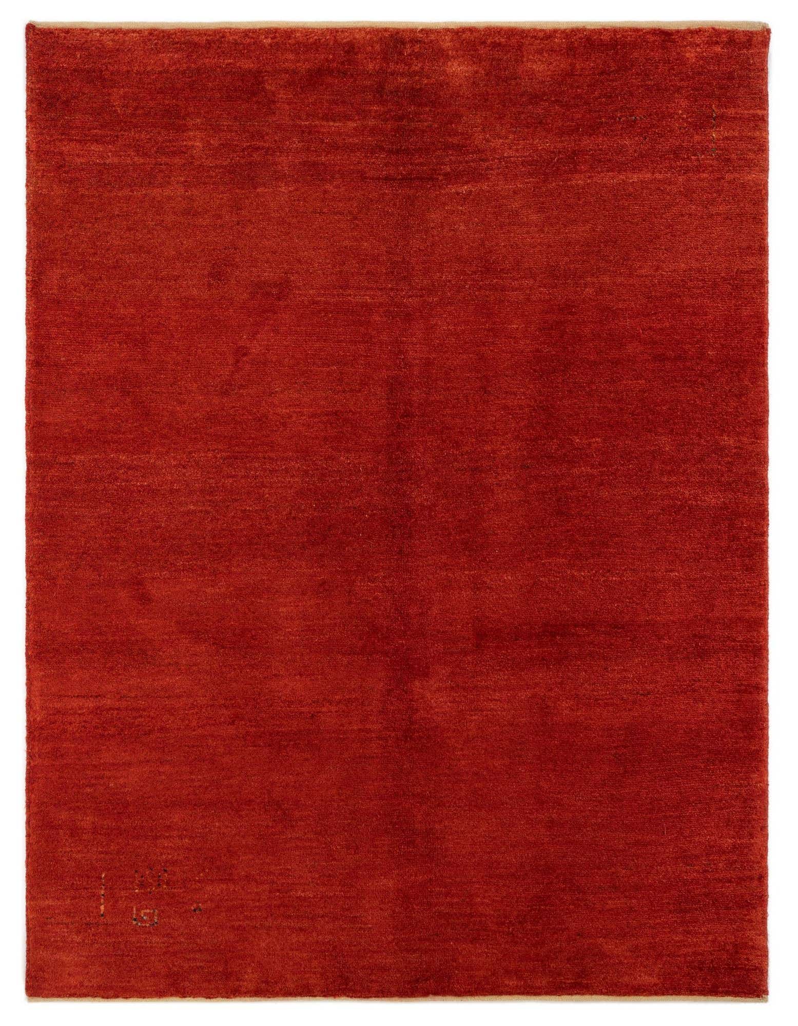 A 4x6 rectangular Gabbeh rug in a rich, solid red hue, handmade from 100% wool with a medium pile.