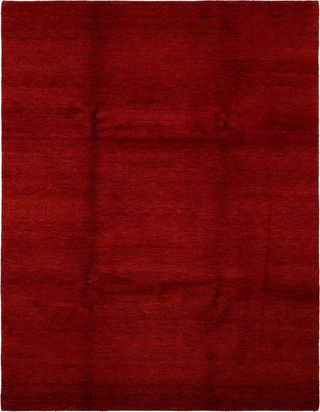 A 7x10 rectangular Gabbeh area rug in a rich, solid red hue, made from 100% wool with a medium pile.