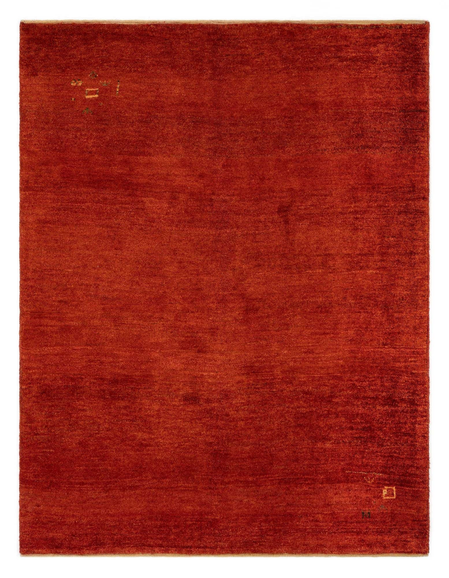 A 4x6 rectangular Gabbeh Shouli rug in deep red, featuring a subtle, modern Persian design with a medium pile.