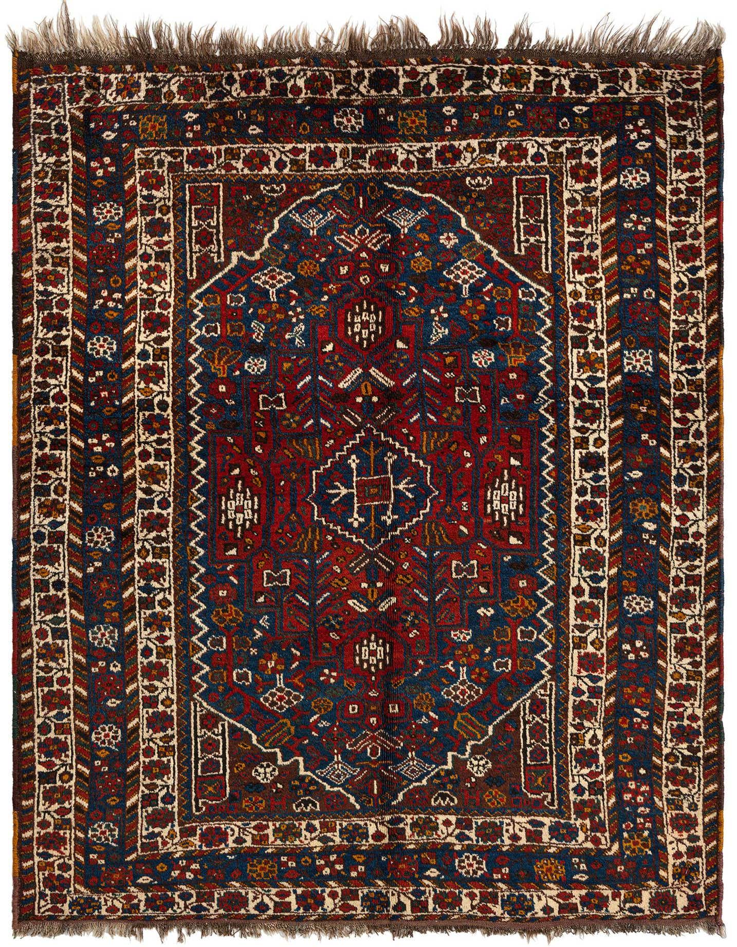 A 4x6 rectangular Ghashghai Persian rug in rich reds and blues with intricate traditional patterns and a fringed edge.