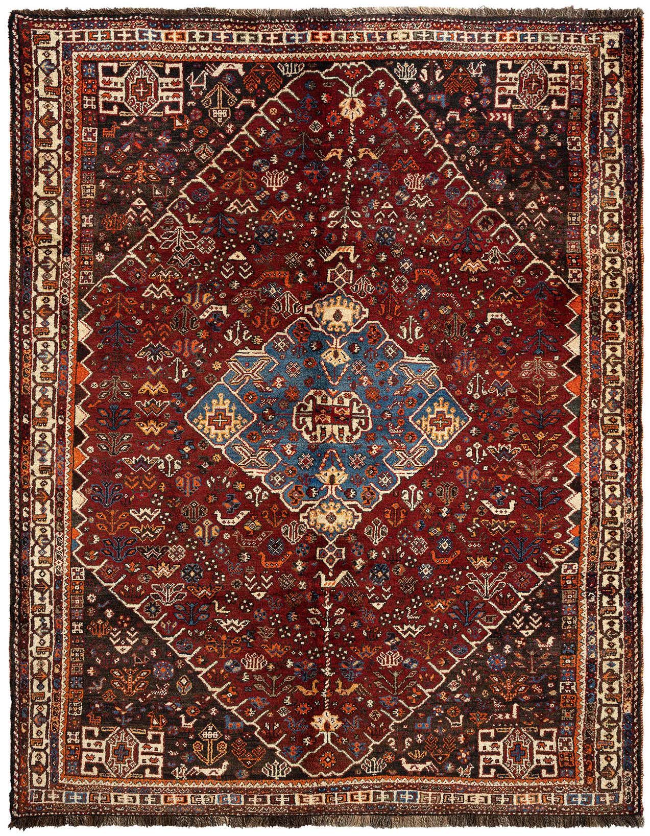A 5x8 rectangular Ghashghai Persian rug featuring a rich red field with intricate traditional patterns and a central blue medallion.