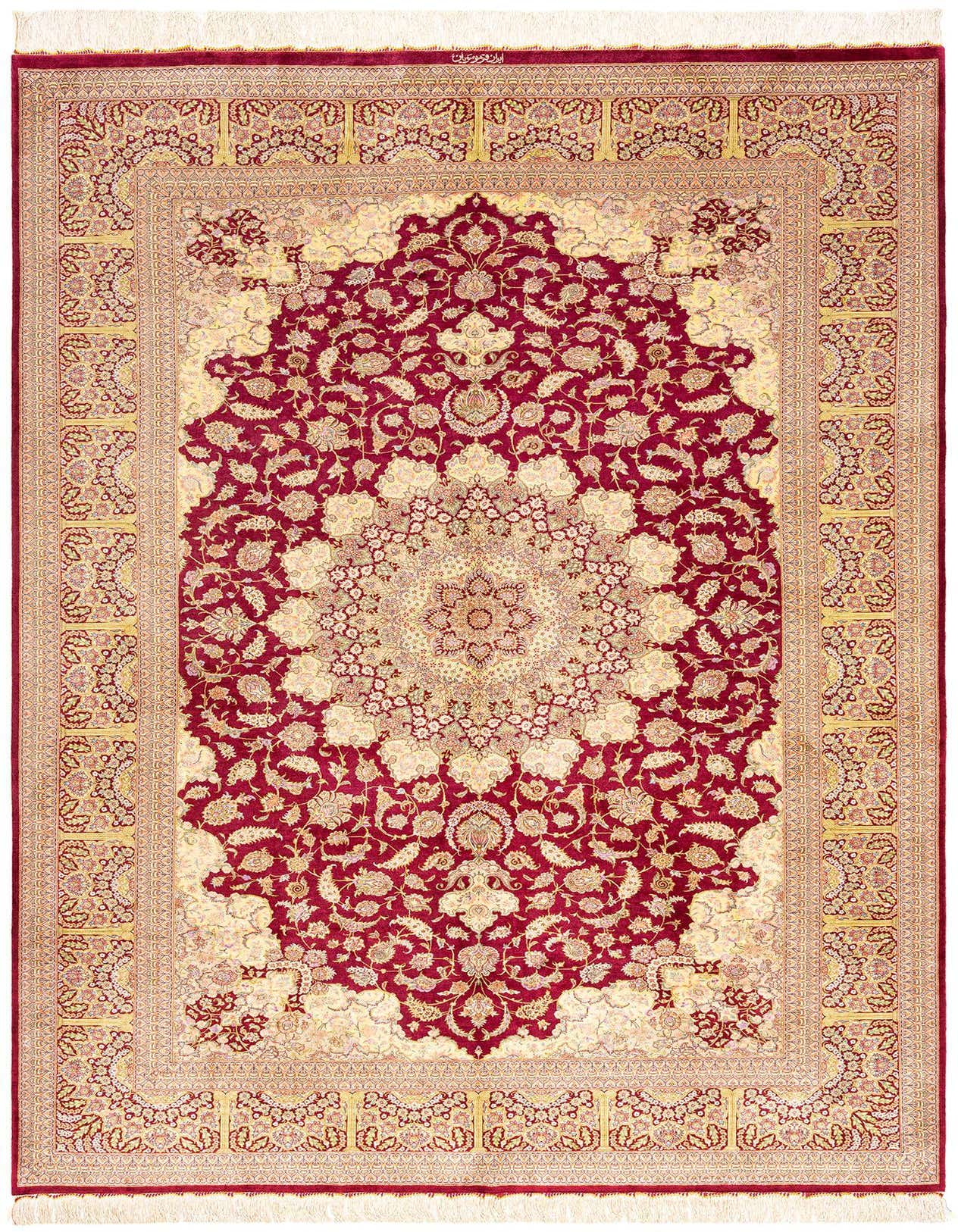 A 6x9 rectangular Ghom Silk Persian rug in rich red and cream, featuring an intricate floral medallion pattern.