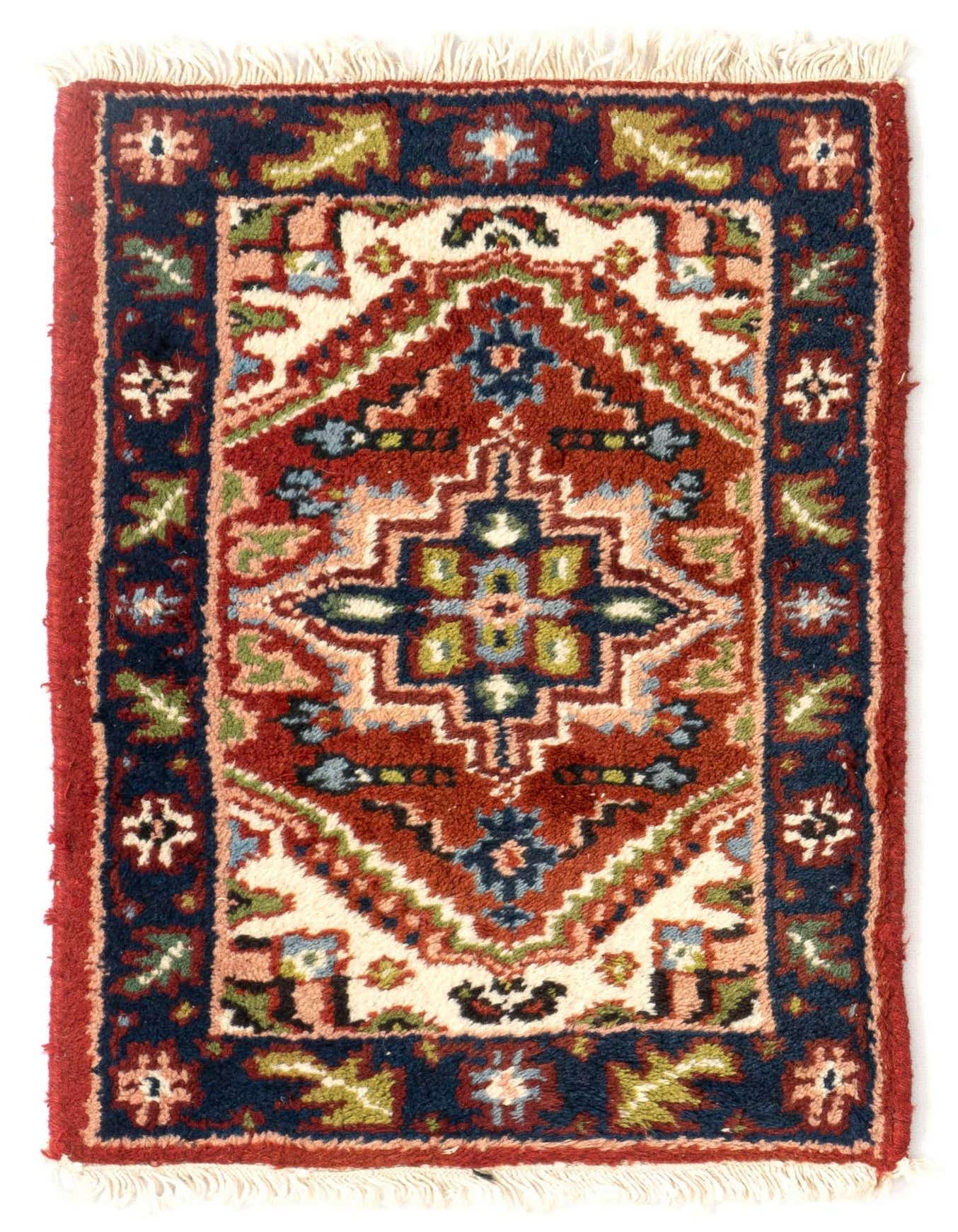 A 1x2 rectangular Hamedan Persian rug with a rich red field, navy border, and tribal geometric patterns in various colors, featuring white fringe.