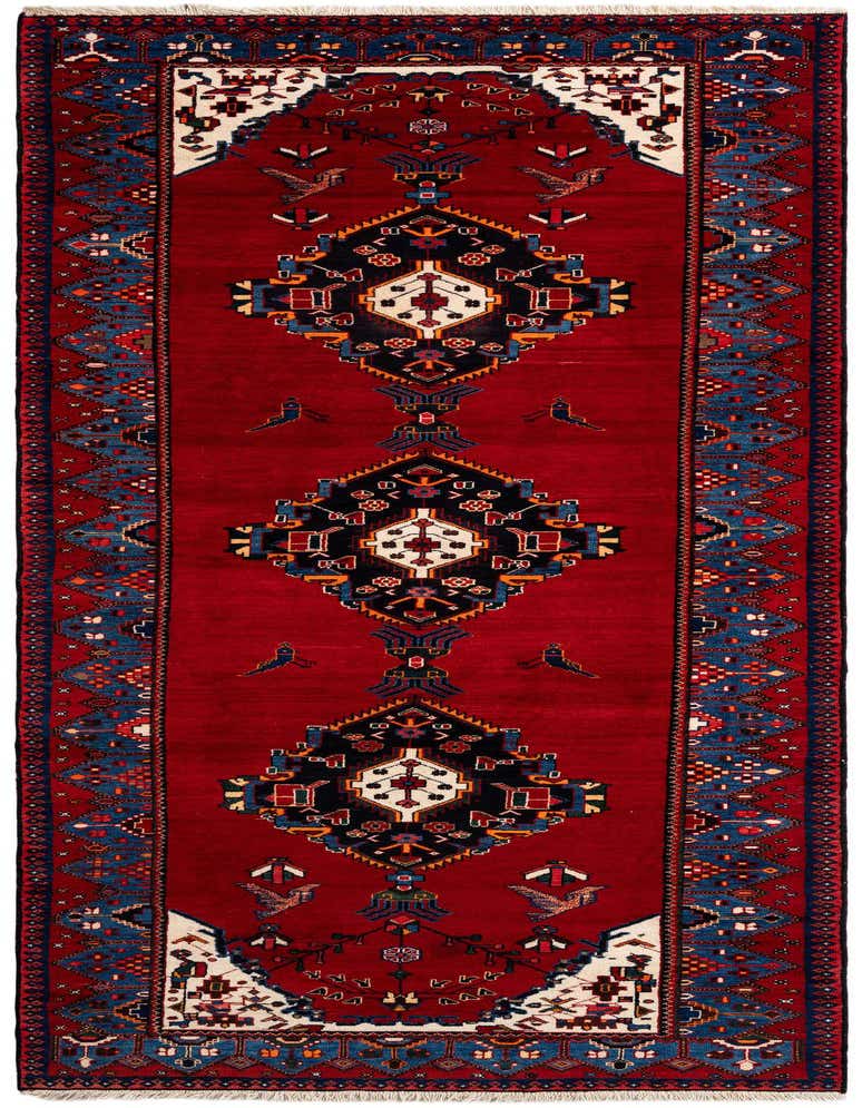 A handmade rectangular Hamedan rug featuring a tribal Persian design in rich reds, blues, and white, with geometric patterns and bird motifs.