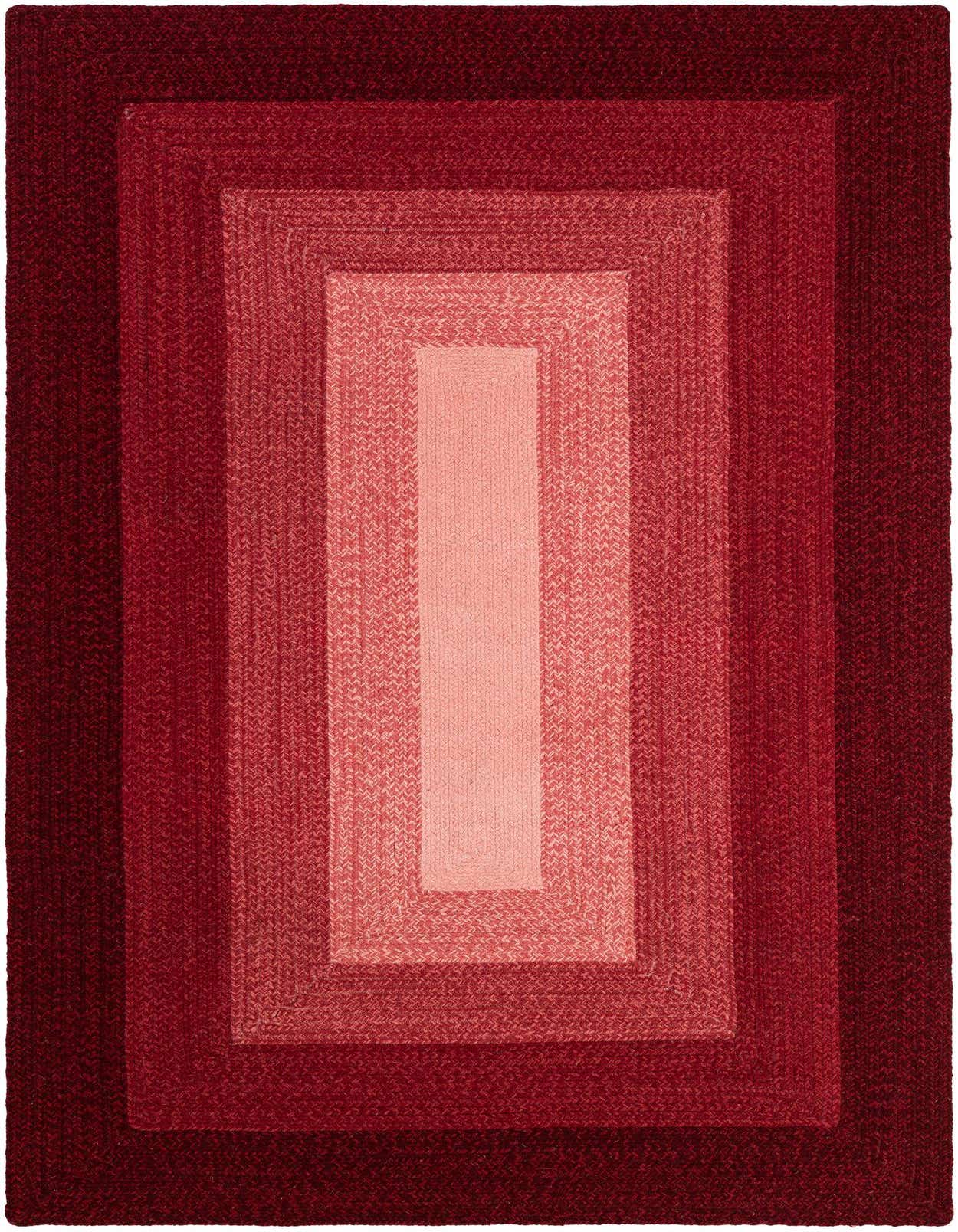 A 5x8 rectangular braided wool rug featuring a modern ombre design with concentric rectangles in varying shades of red, from deep maroon to light coral.