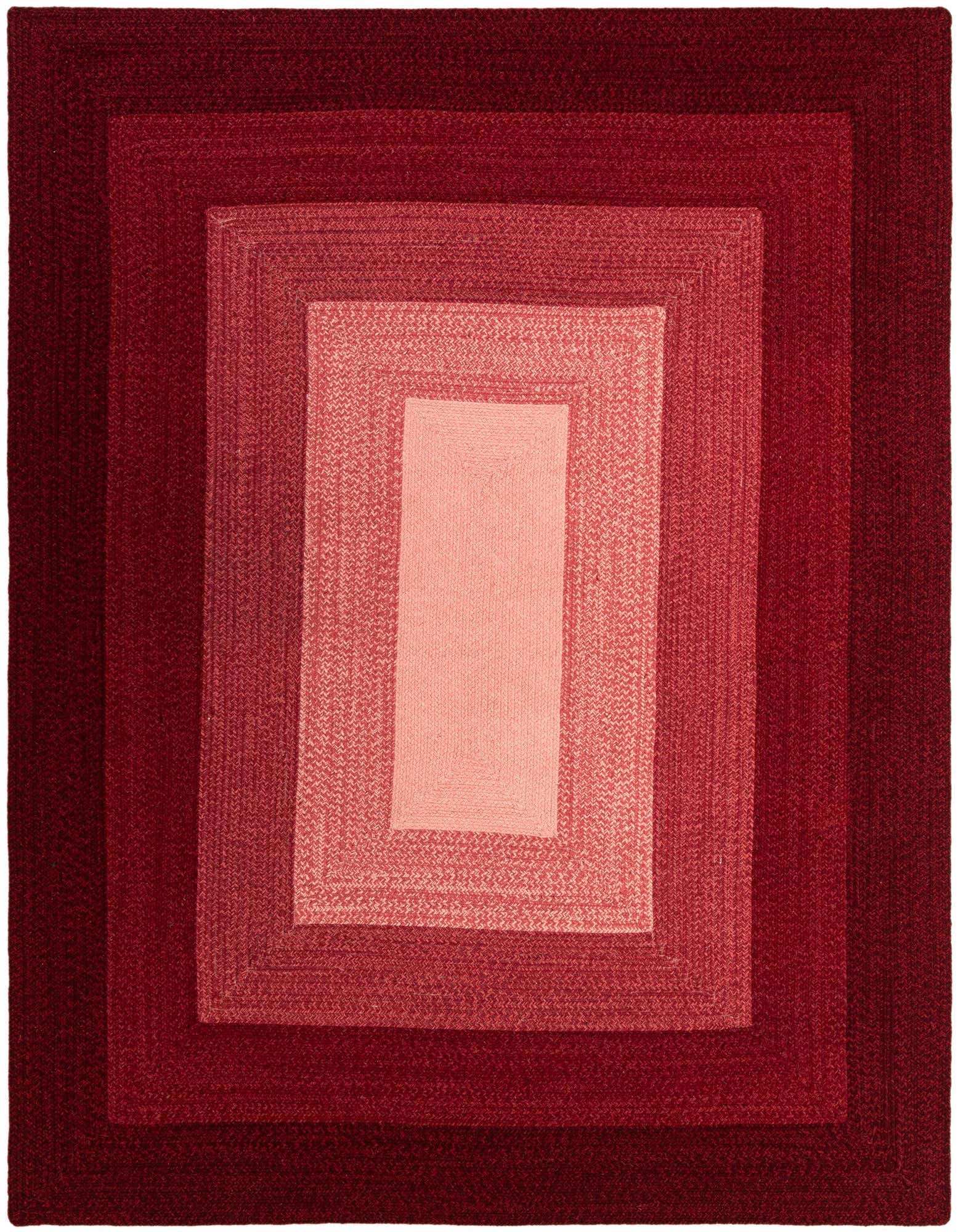 A rectangular 8x10 Hand Braided Wool rug by Rugs.com featuring a modern design with concentric rectangles in varying shades of red, from deep maroon to light coral.