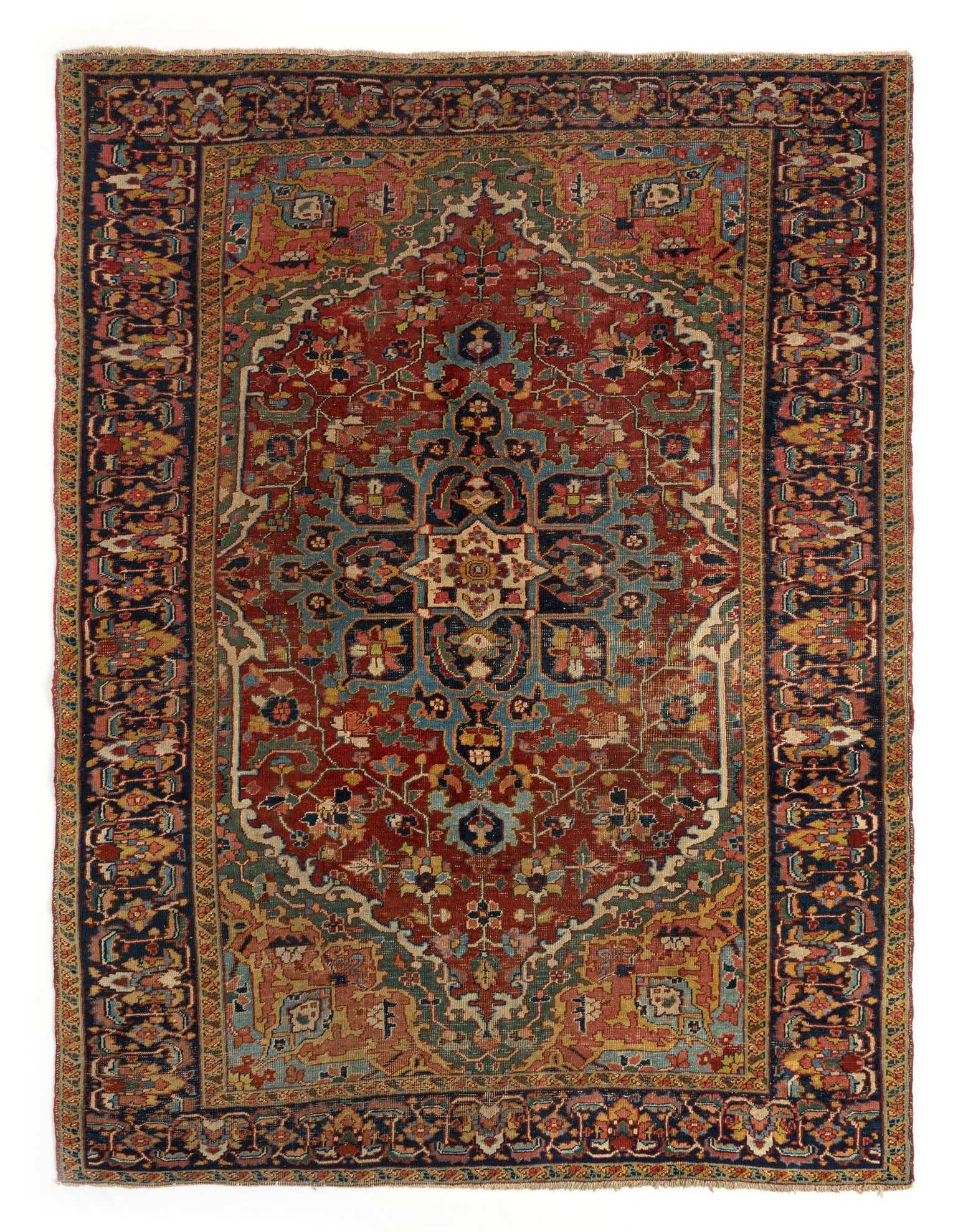 A 6x9 rectangular Heriz Persian rug with a rich red field, intricate blue and gold medallion, and detailed floral border.