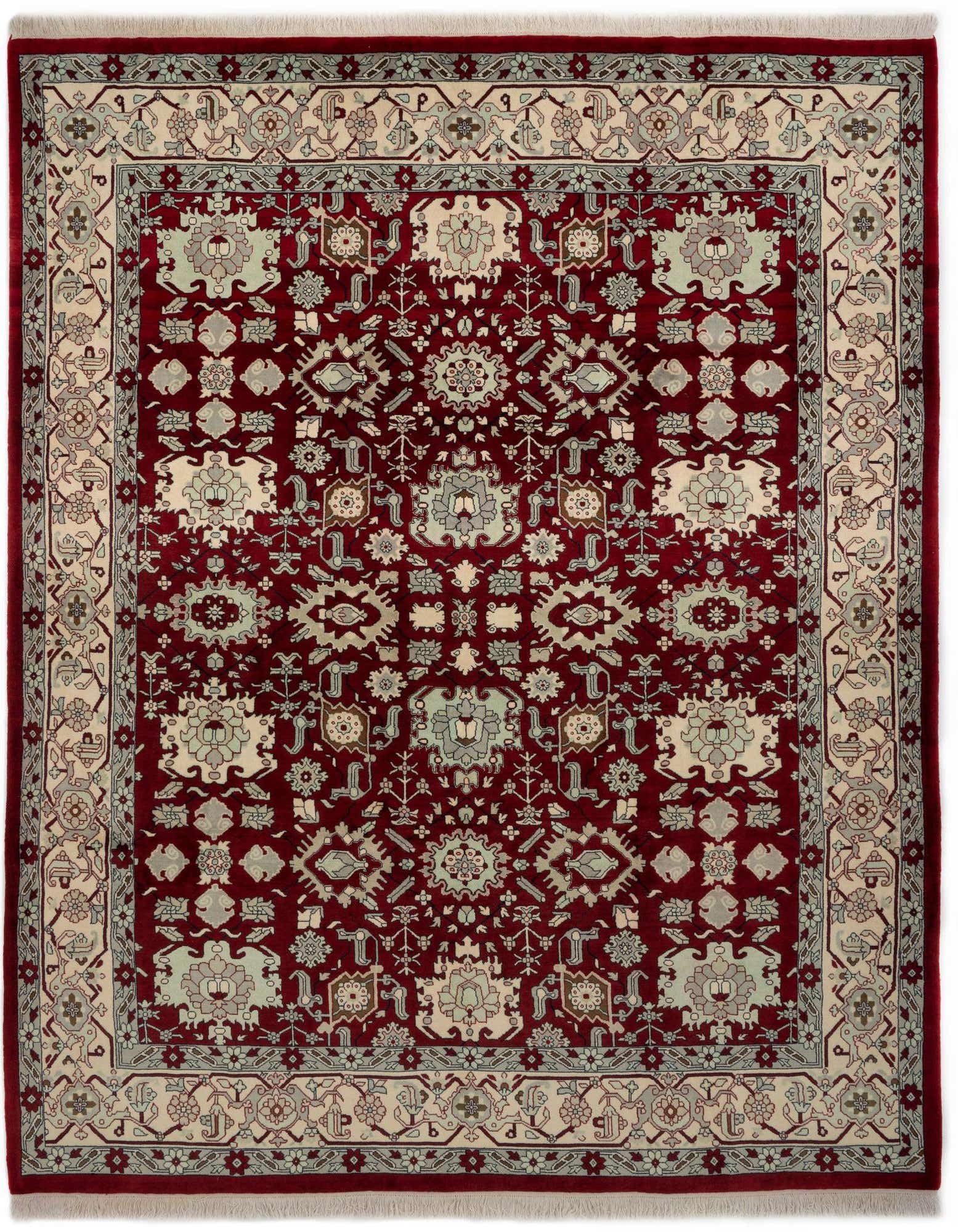 An 8x10 rectangular Indo Tabriz Persian rug in rich red with intricate floral and medallion patterns in cream and light blue.