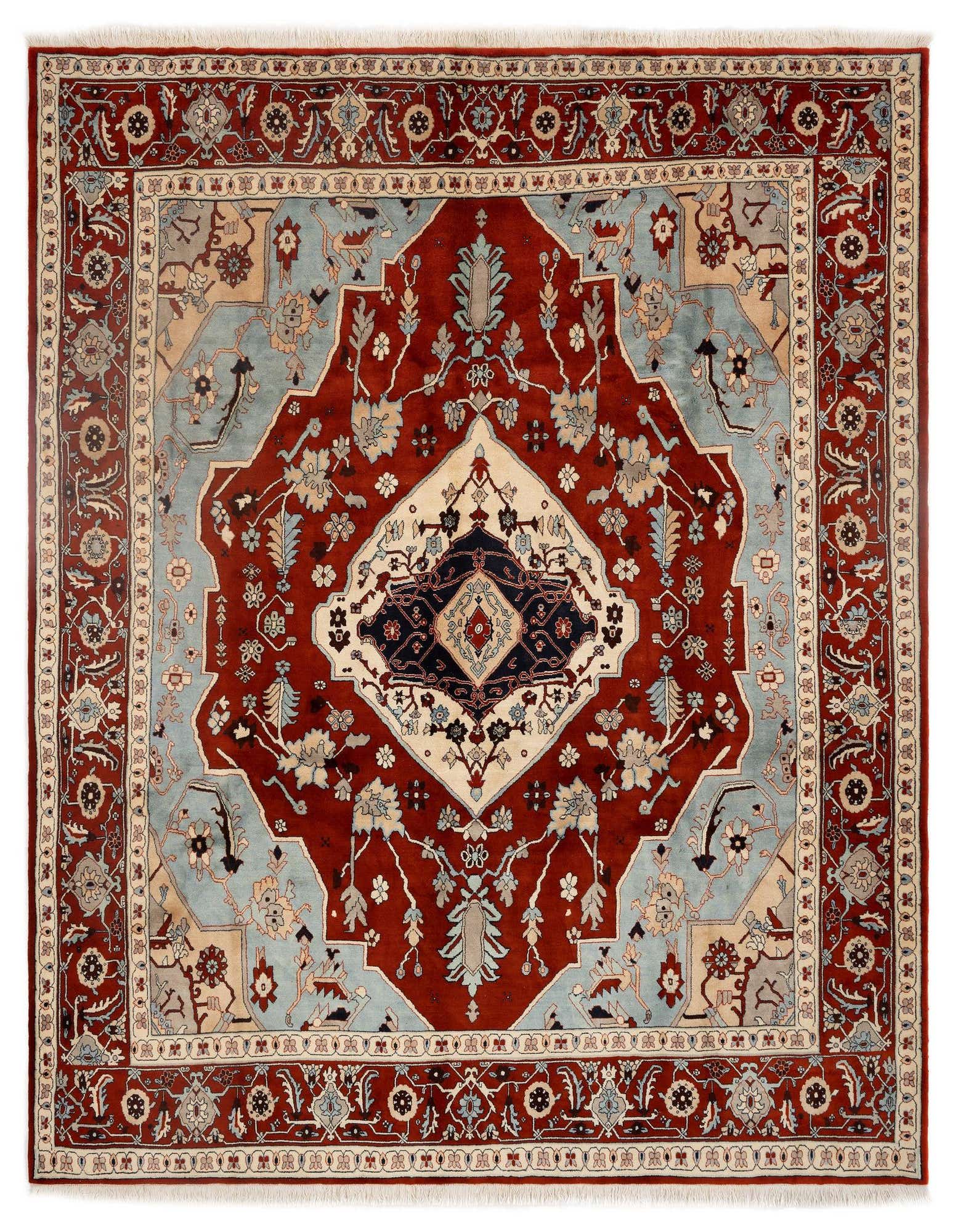 A 9x12 rectangular Indo Tabriz Persian rug featuring a central medallion in reds, light blue, and cream, with intricate floral patterns.