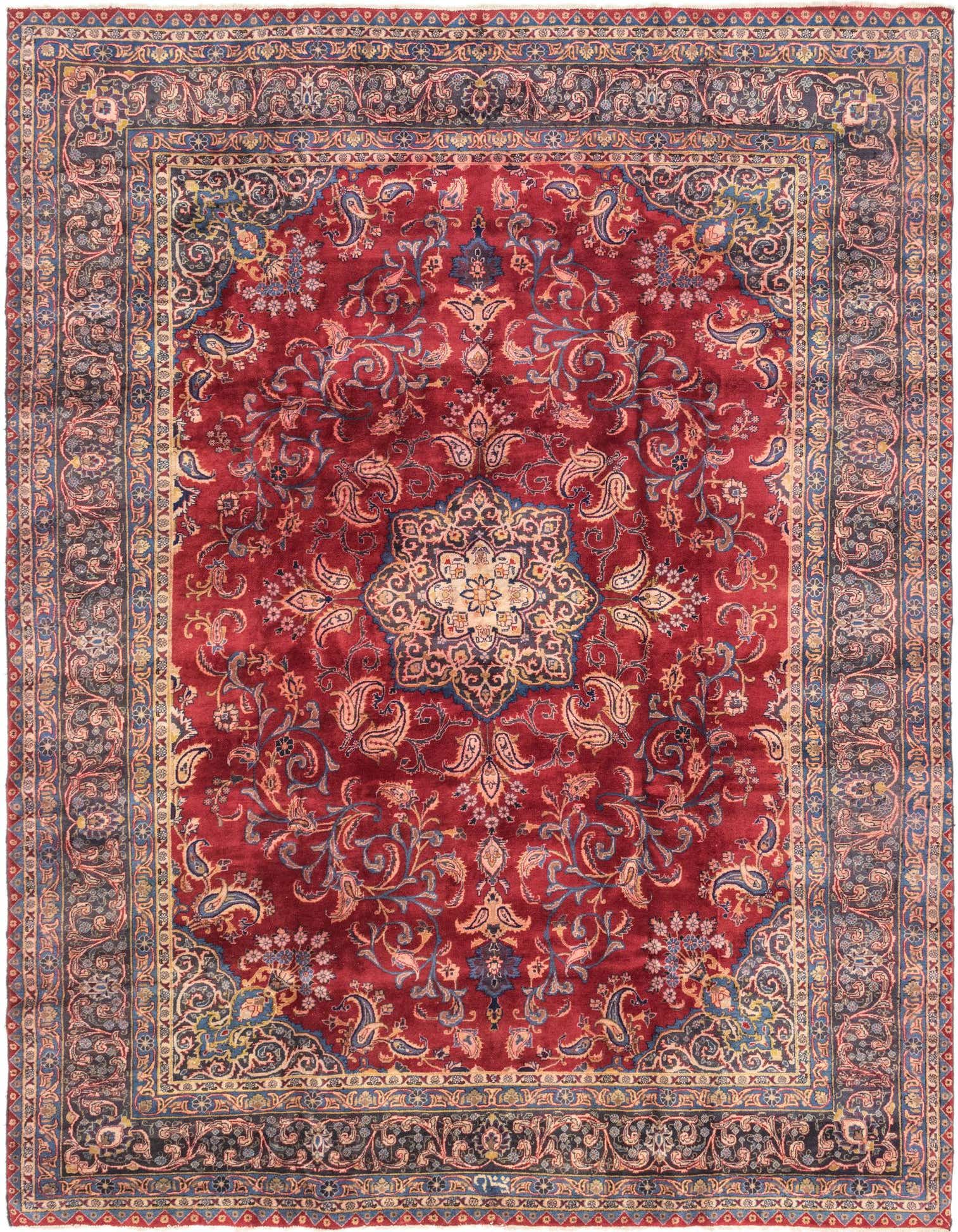 A 10x13 rectangular red Persian rug with a central medallion and intricate botanical patterns in blue, gold, and cream.