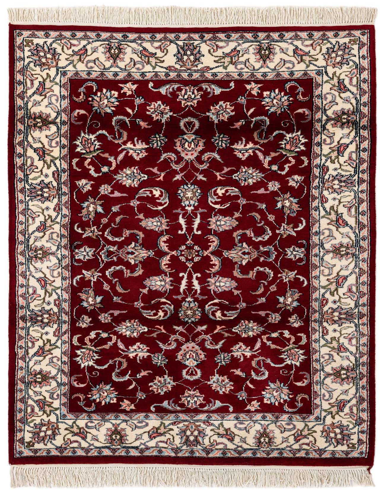 A 4x6 rectangular red traditional wool rug with an intricate floral and vine pattern and a cream border.