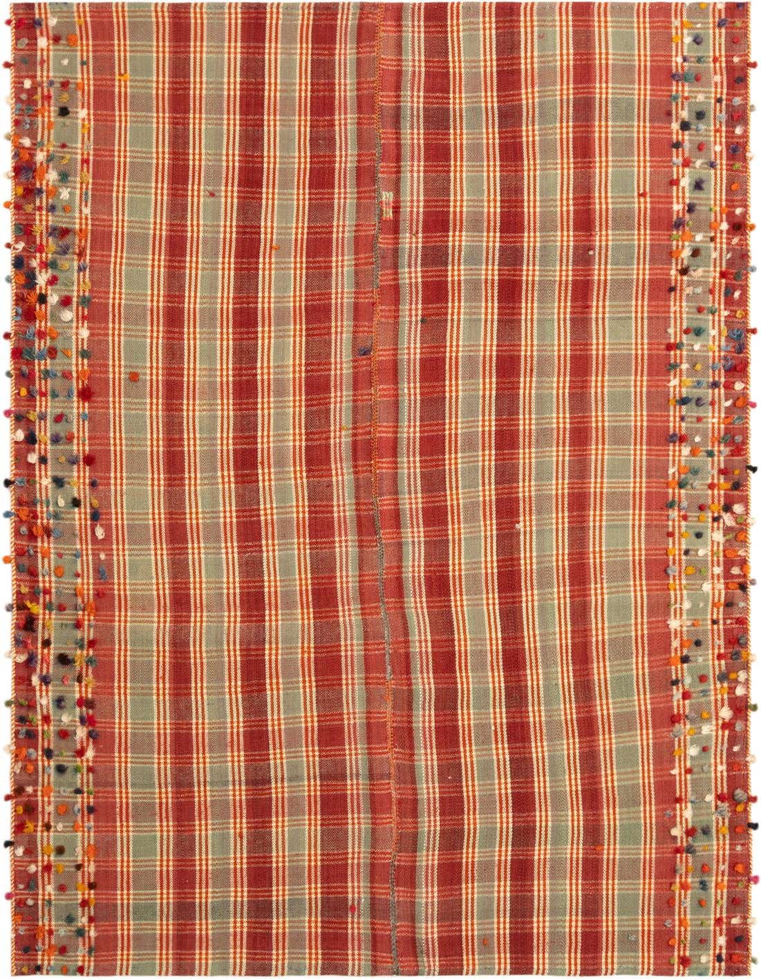 A handmade 4x6 rectangular Jajim rug with a red and green plaid pattern, featuring colorful pom-pom tassels along the sides.