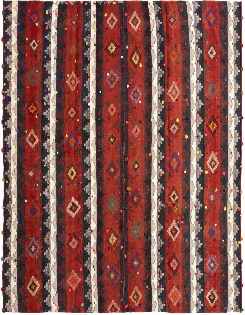 A 5x8 rectangular Jajim Persian wool rug featuring bold red, black, and white stripes with colorful diamond patterns and playful pom-pom accents.