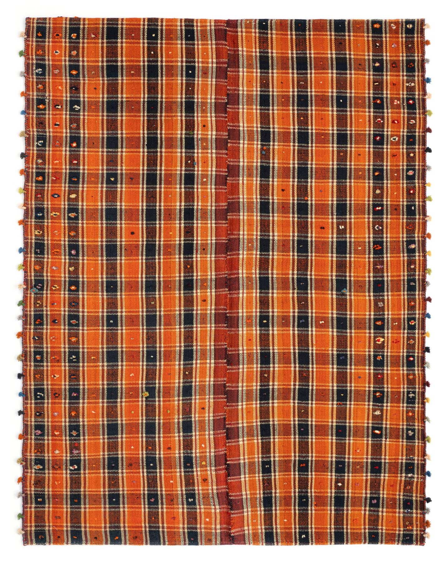 A 5x8 rectangular Jajim rug featuring a vibrant red and black plaid pattern with colorful tassels.