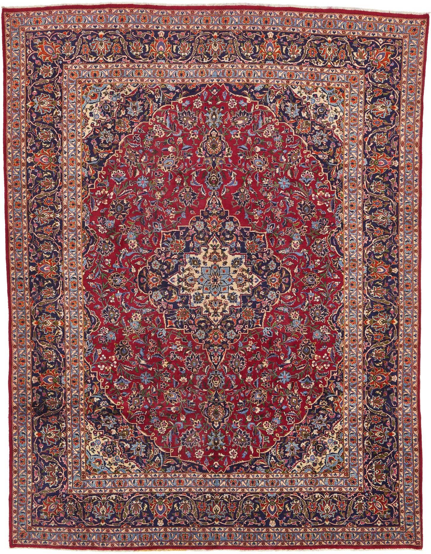 A 10x13 rectangular red wool rug with a traditional Persian botanical medallion pattern and navy border.