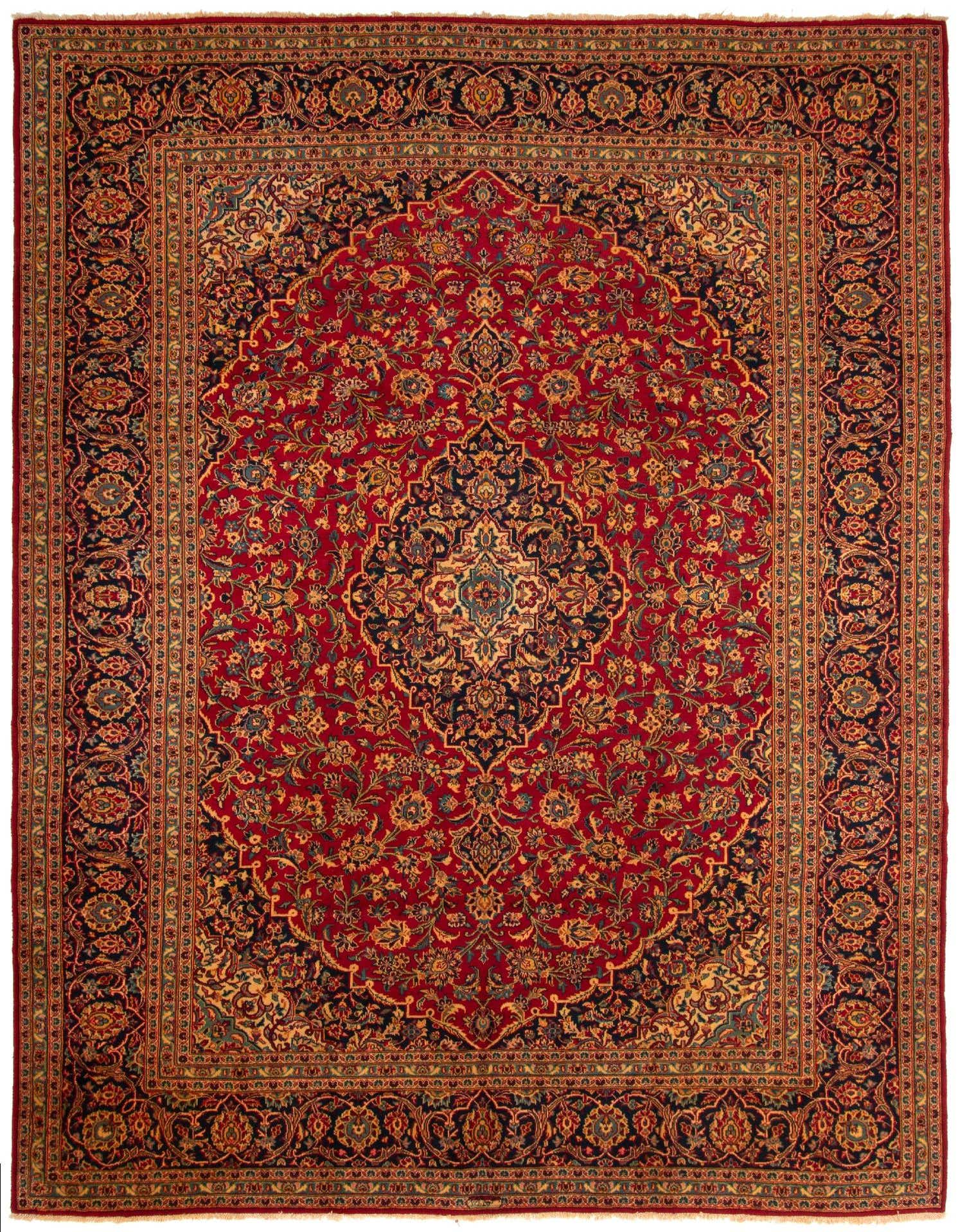 A 10x13 rectangular Persian rug with a rich red field and intricate floral medallion pattern in navy, gold, and teal.