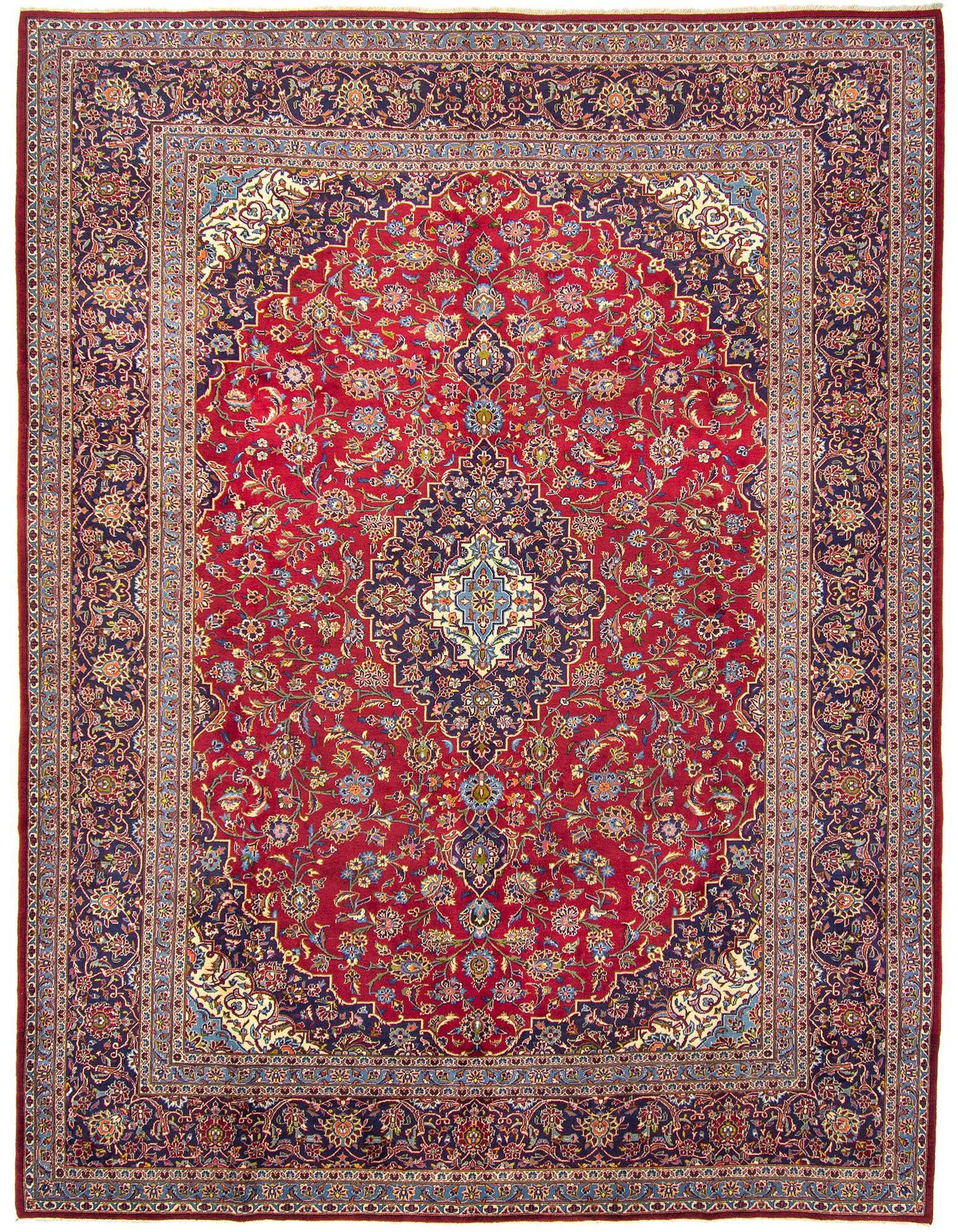 A 10x14 rectangular Persian rug in rich reds with intricate floral patterns and a navy border, suitable for a formal living room.