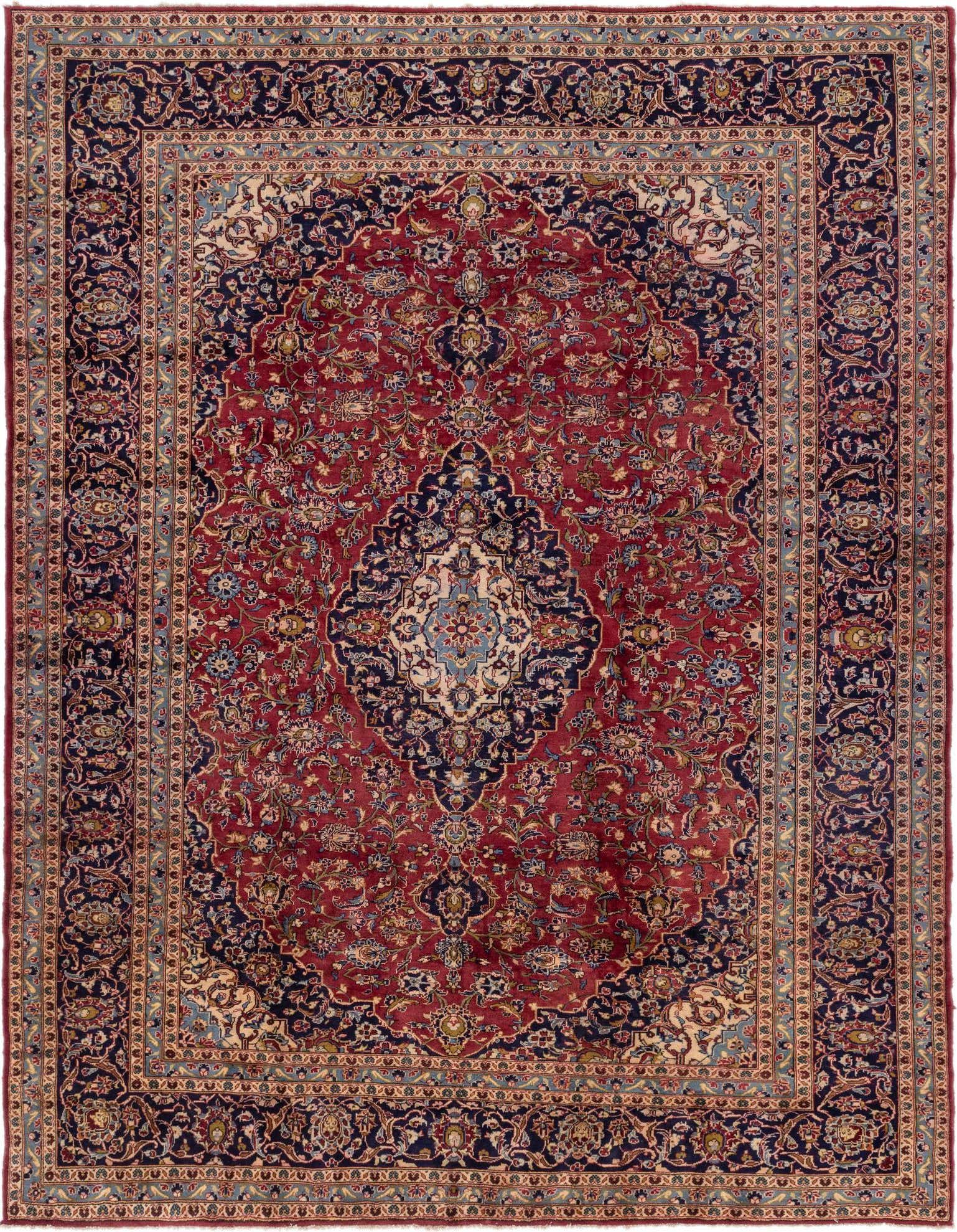 A 10x13 rectangular red Persian wool rug with an intricate navy and cream medallion and botanical patterns.