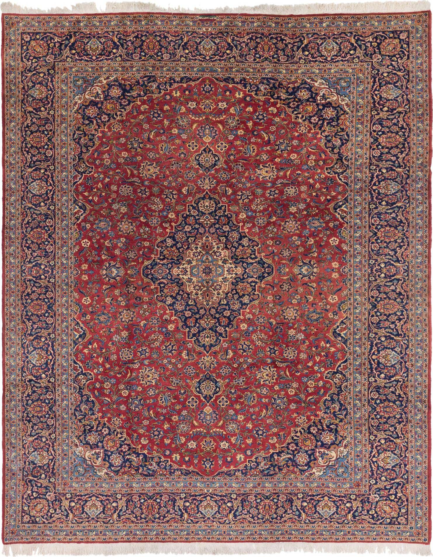 A 10x13 rectangular red Persian rug with a large central medallion and intricate botanical patterns in navy blue and gold.