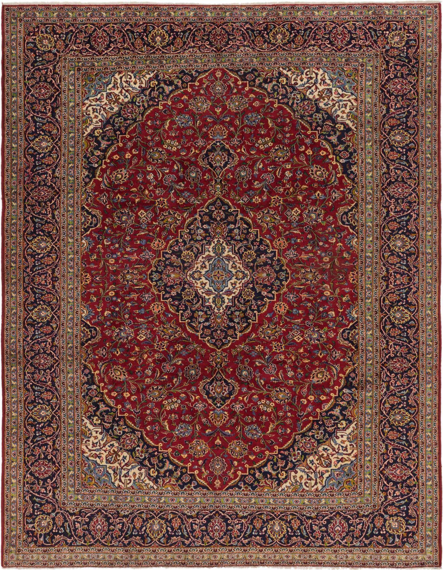 A 10x13 rectangular Kashan rug featuring a rich red field with an intricate navy and cream medallion and botanical patterns, surrounded by a detailed navy border.