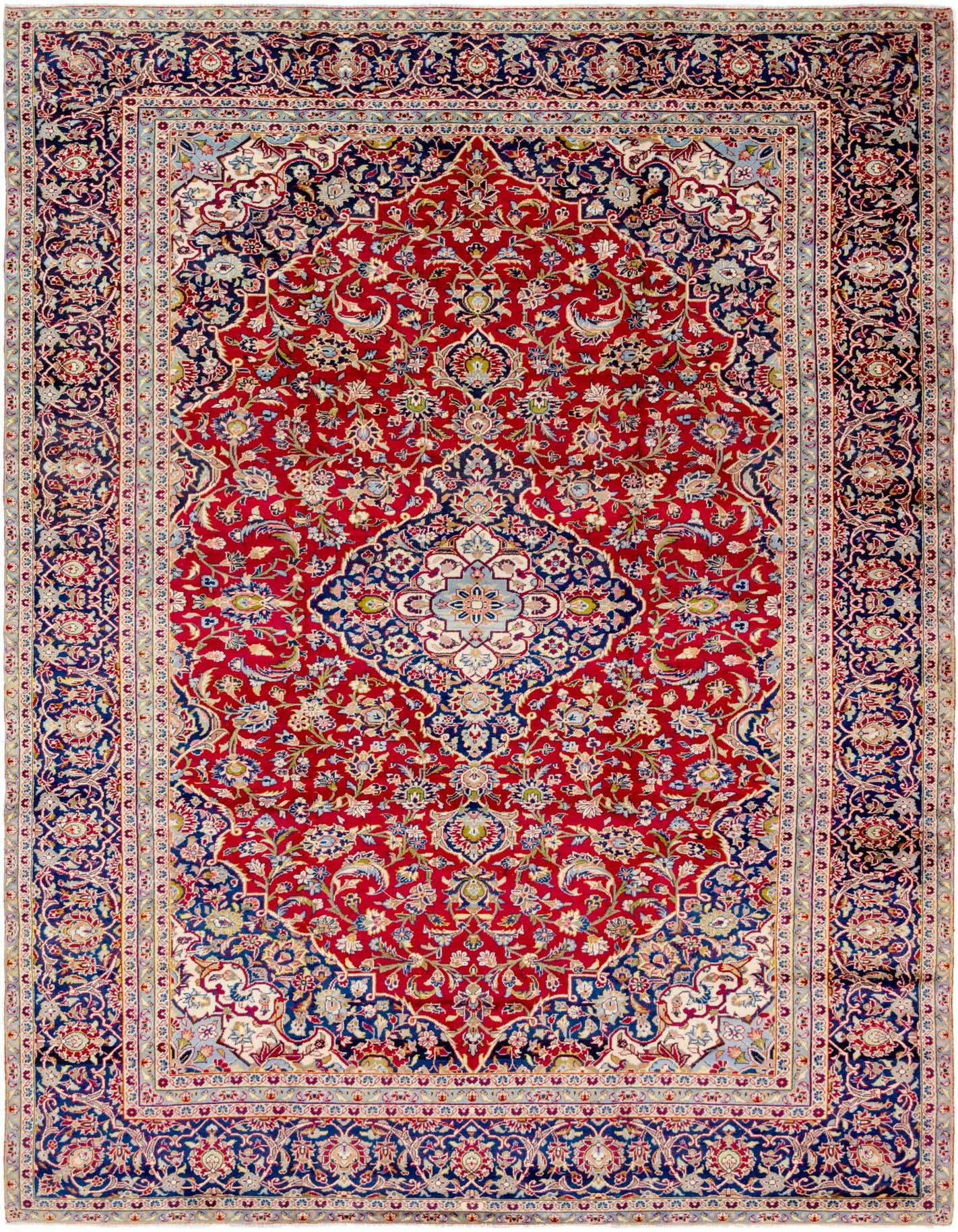 A 9x12 rectangular Kashan rug featuring a traditional Persian medallion design in rich reds and deep blues, with intricate floral patterns.