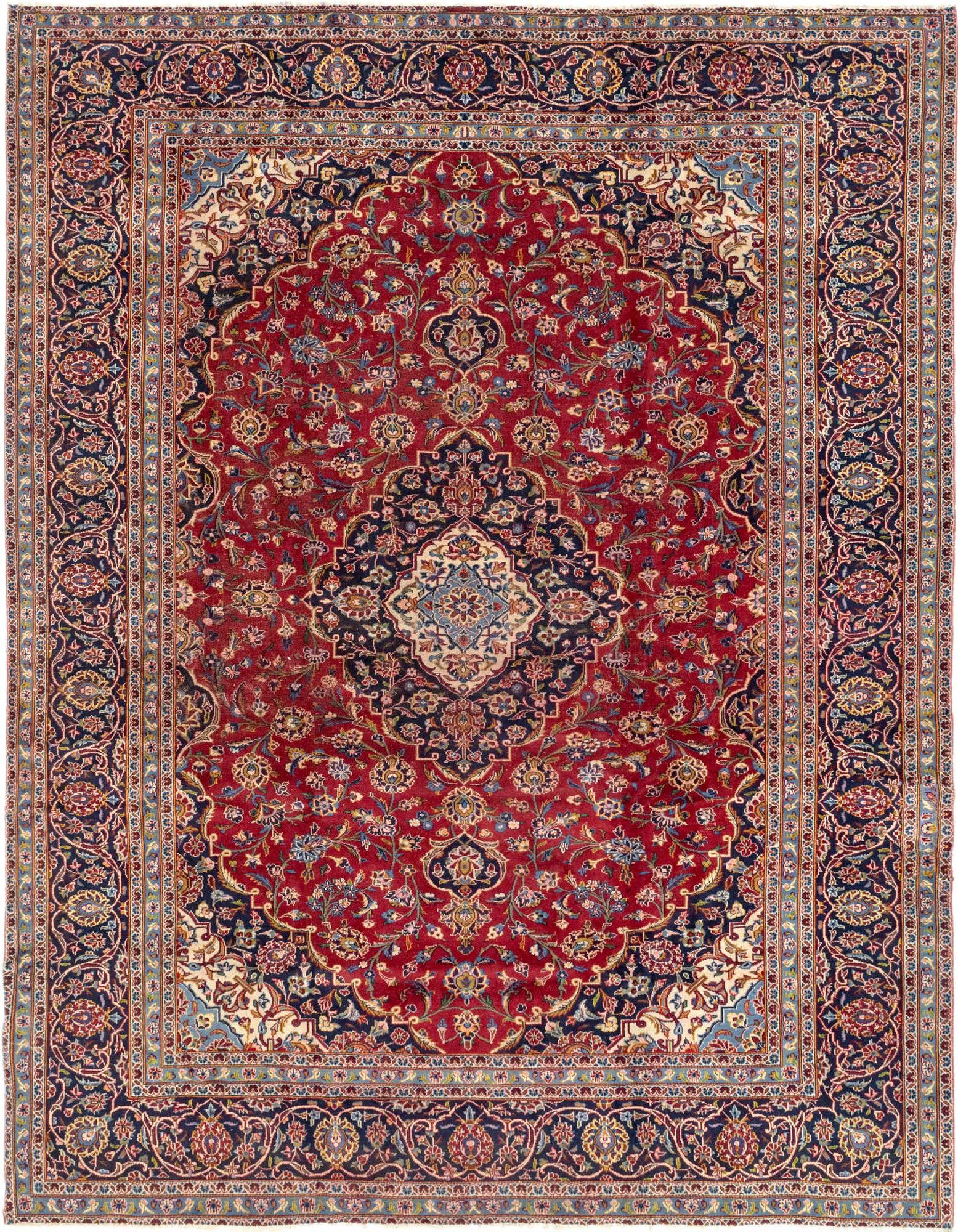 A large 10x12 rectangular red Persian rug with a central medallion and intricate botanical patterns in navy, cream, and gold.