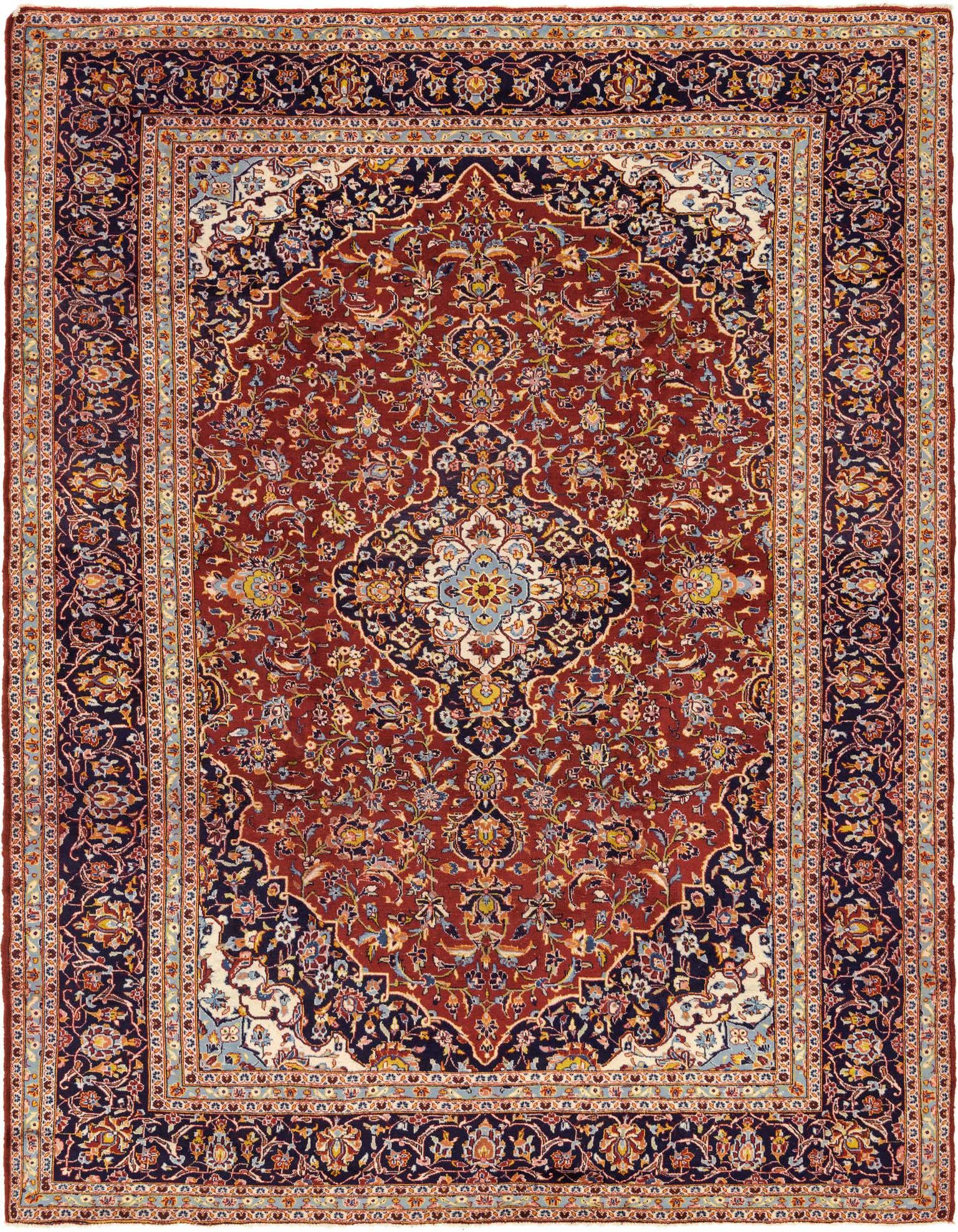 A 10x13 rectangular Kashan Persian rug in rich red with a central medallion and intricate floral patterns, framed by a dark blue border.