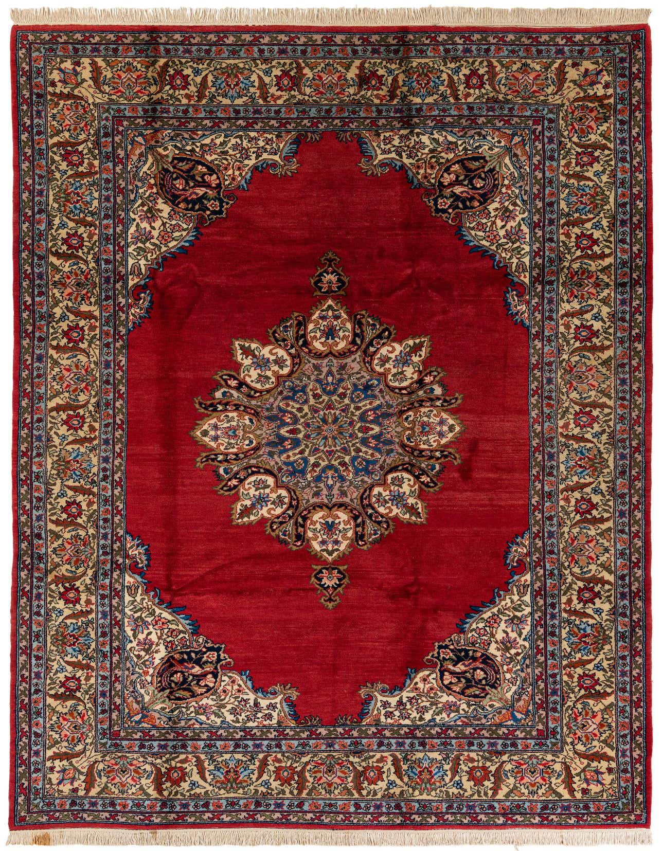 A 7x10 rectangular red traditional wool rug with an ornate central medallion and intricate floral border.