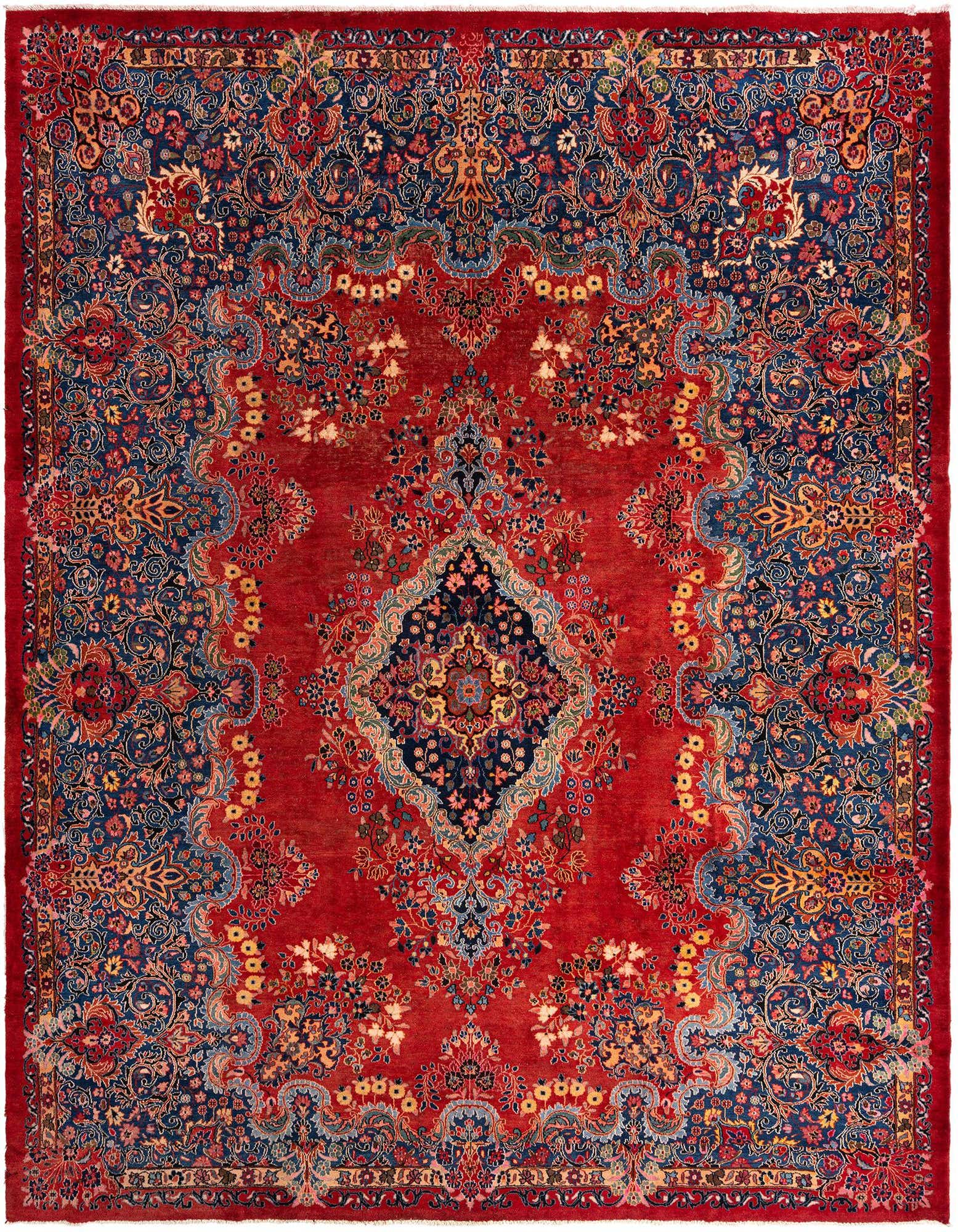 A large 10x13 rectangular red Persian wool rug with intricate blue, gold, and red floral patterns, ideal for a living room.