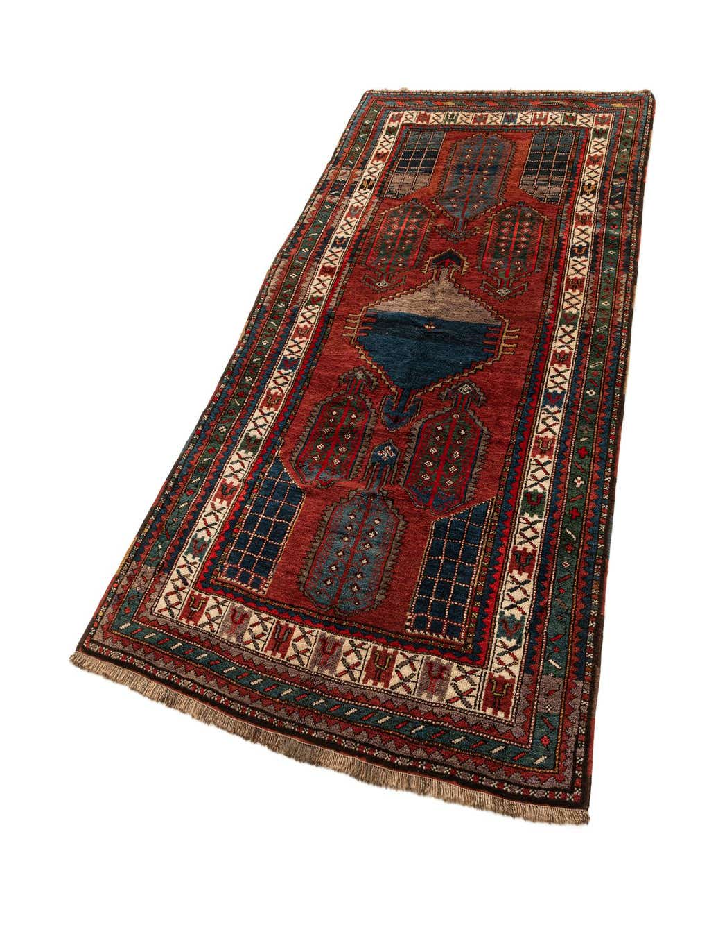 A 5x8 rectangular red Kazak rug with intricate traditional patterns in blue, green, and cream, featuring a thin pile.