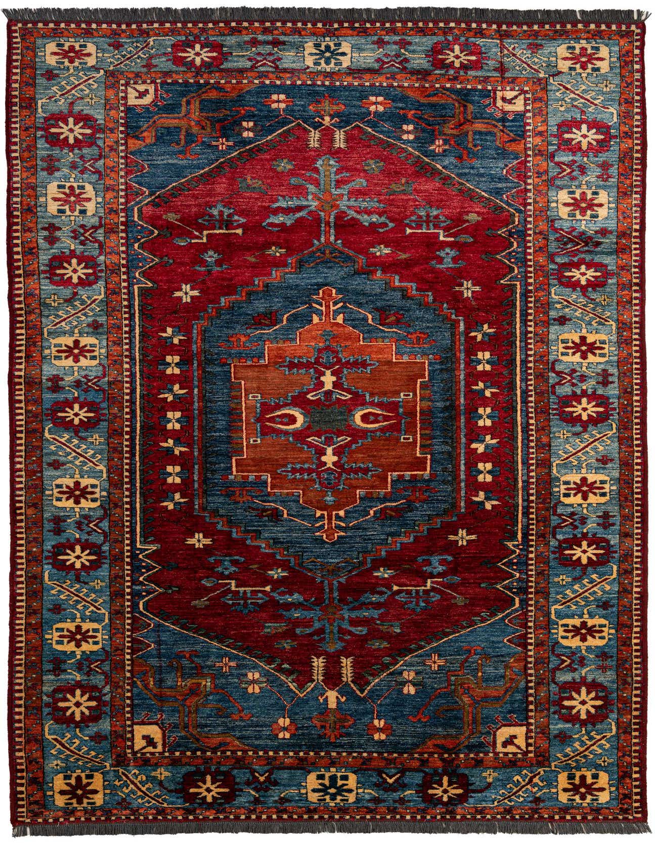 A 7x10 rectangular Rugs.com Kazak rug with a central medallion in reds and blues, featuring intricate traditional patterns.